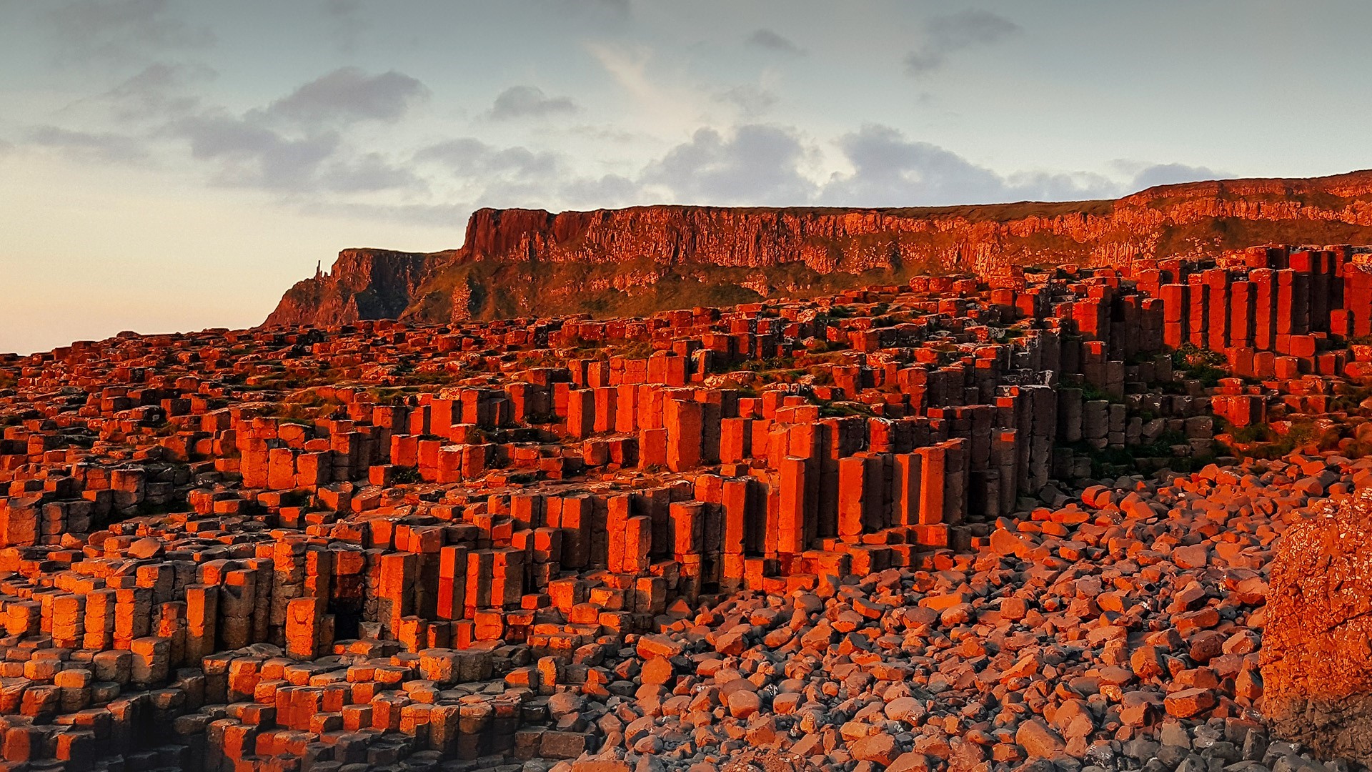 Basalt columns at Giant's Causeway, Northern Ireland during sunset HD Wallpaper