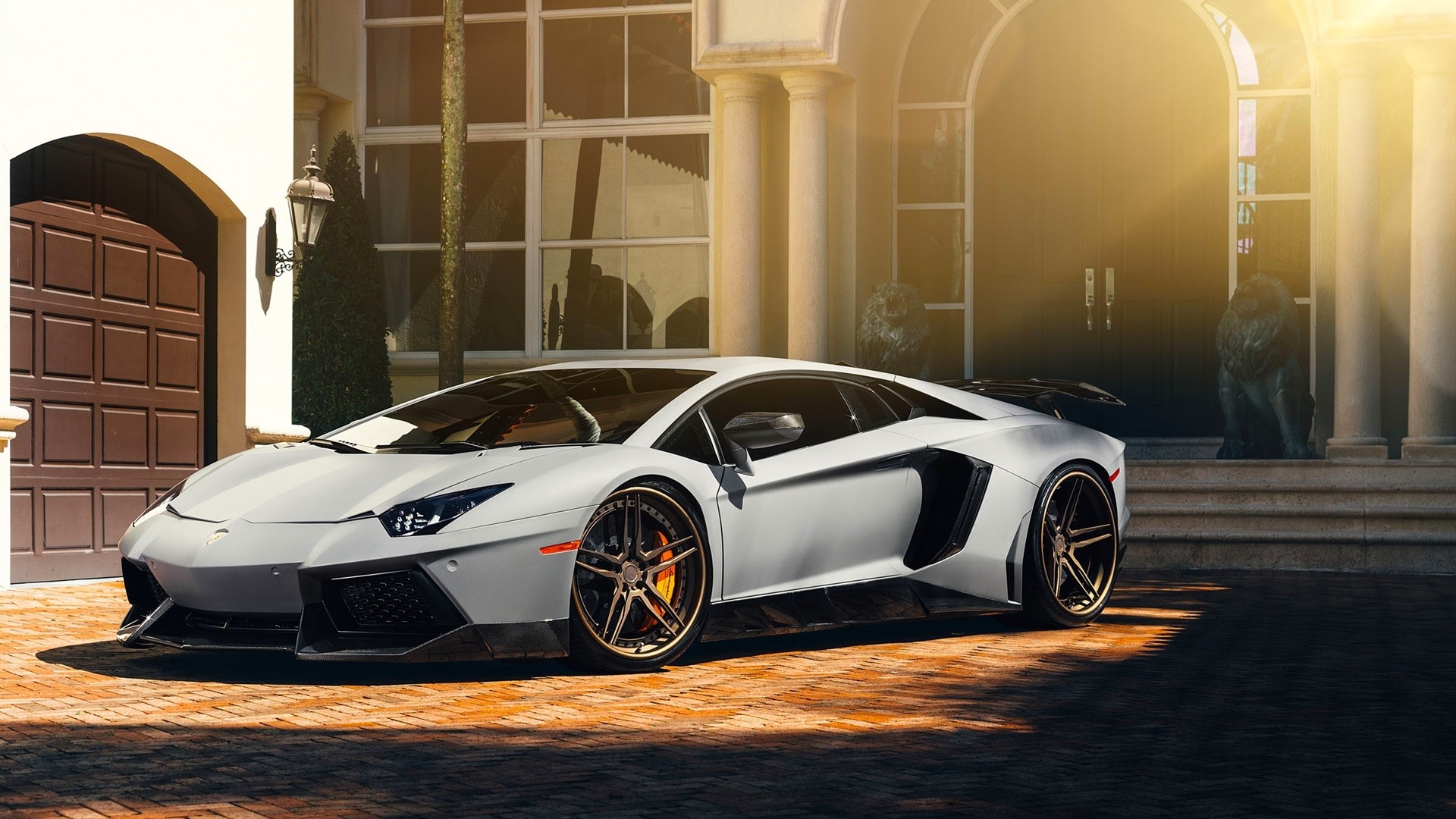 White Lamborghini Aventador parked in front of a mansion HD Wallpaper