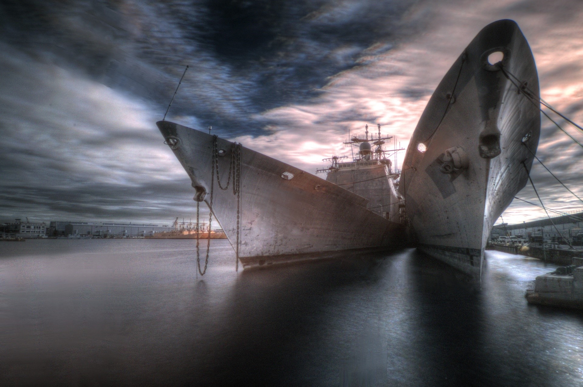Two ships docked in a harbor under a cloudy sky HD Wallpaper