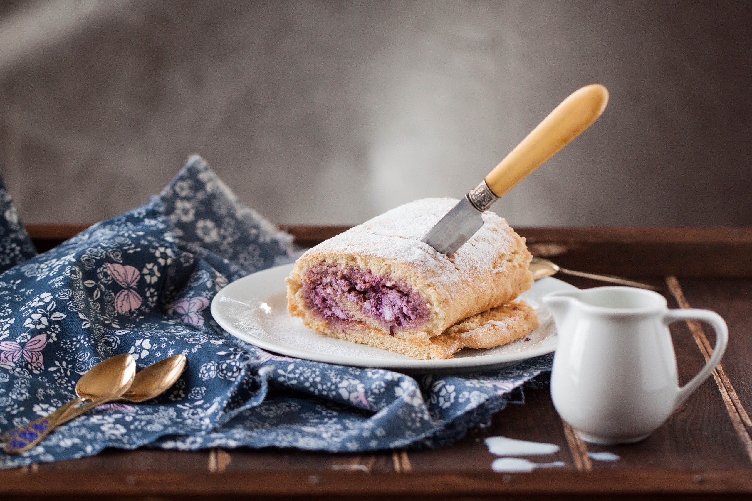 Dessert roll with purple filling on a plate HD Wallpaper
