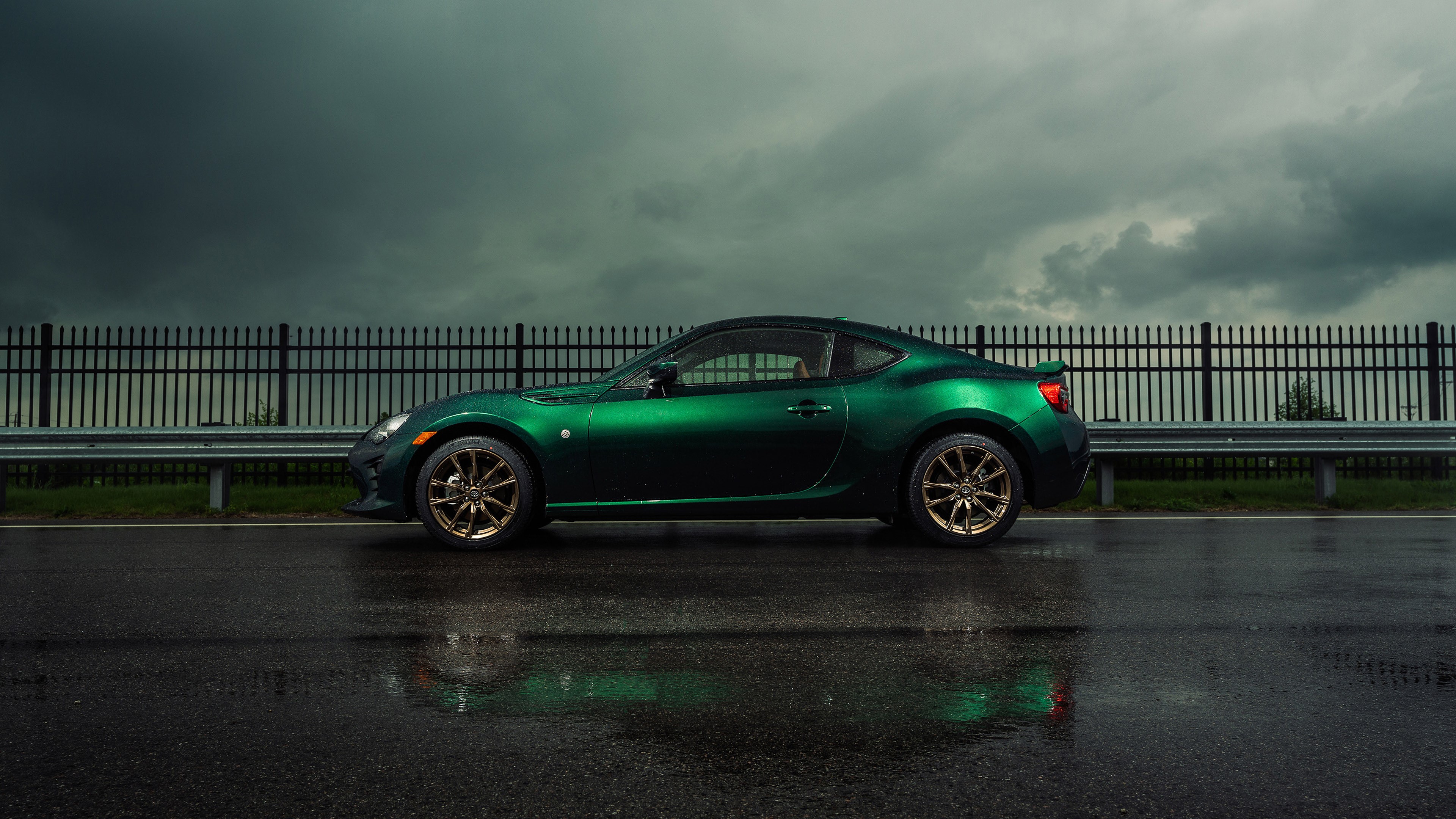 Green Toyota GT86 on a wet road HD Wallpaper