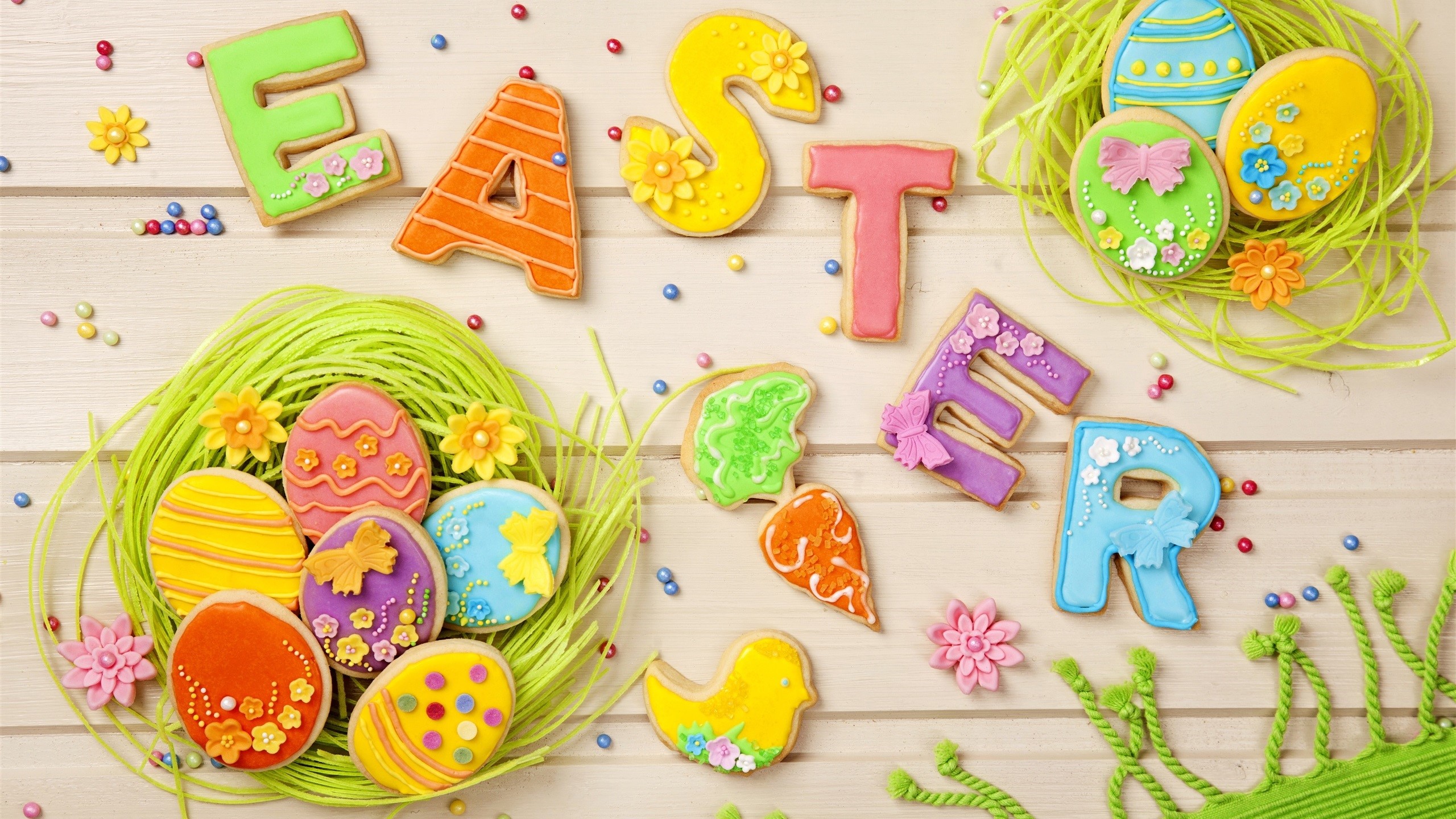 Easter cookies spelling out "EASTER" with decorated eggs and a chick HD Wallpaper
