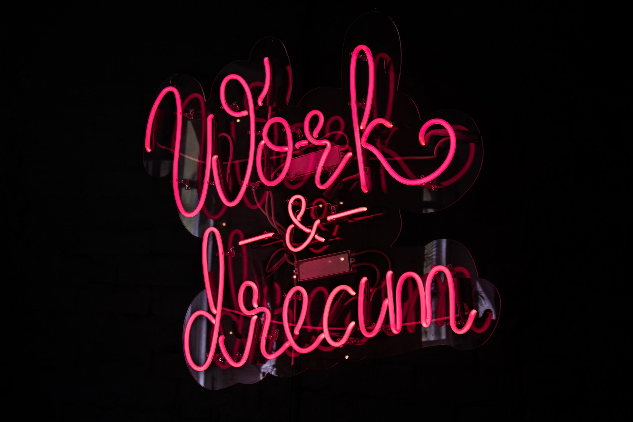 Pink neon sign "Work & Dream" HD Wallpaper