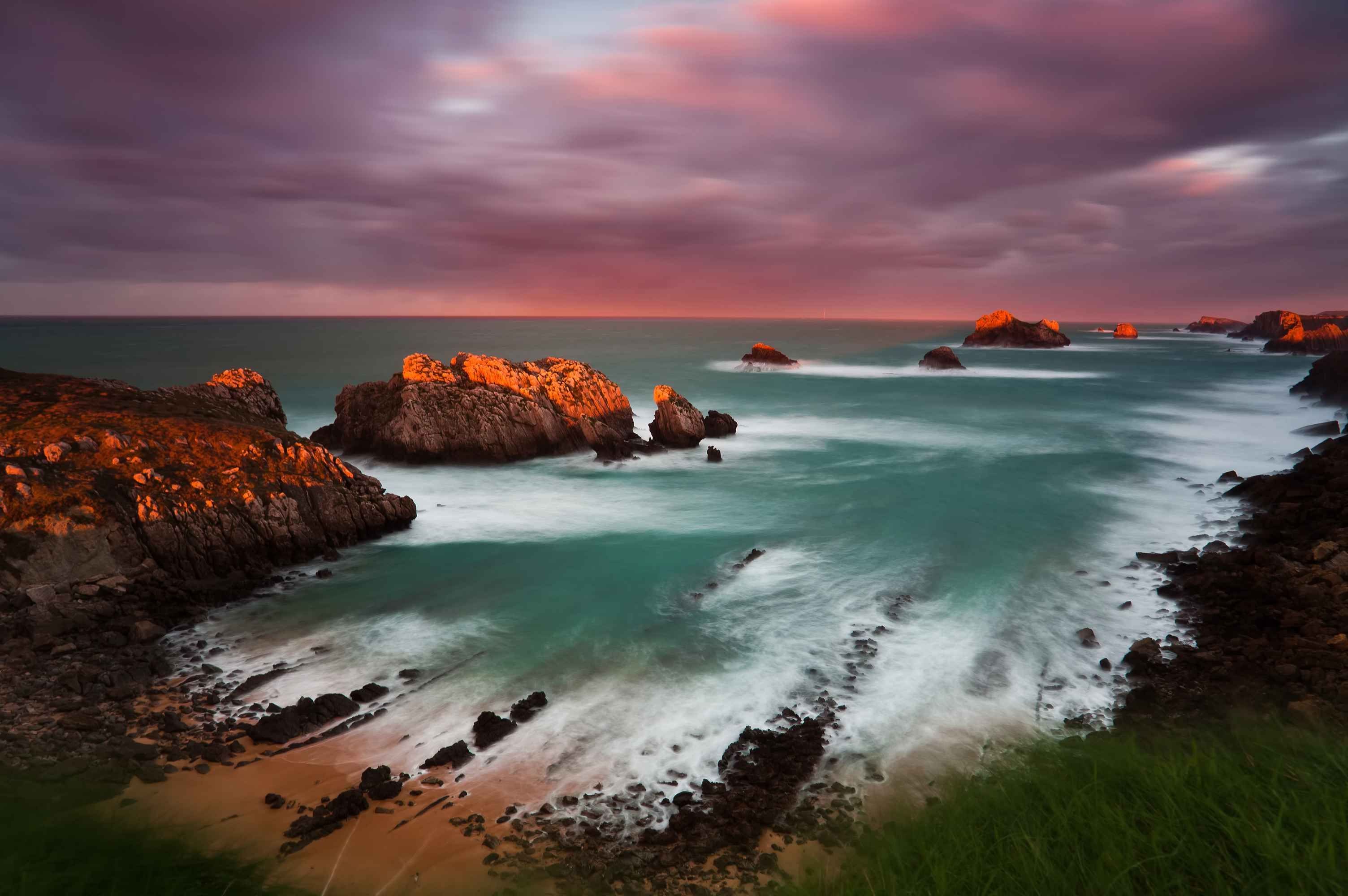 Rocky coastline with waves at sunset HD Wallpaper