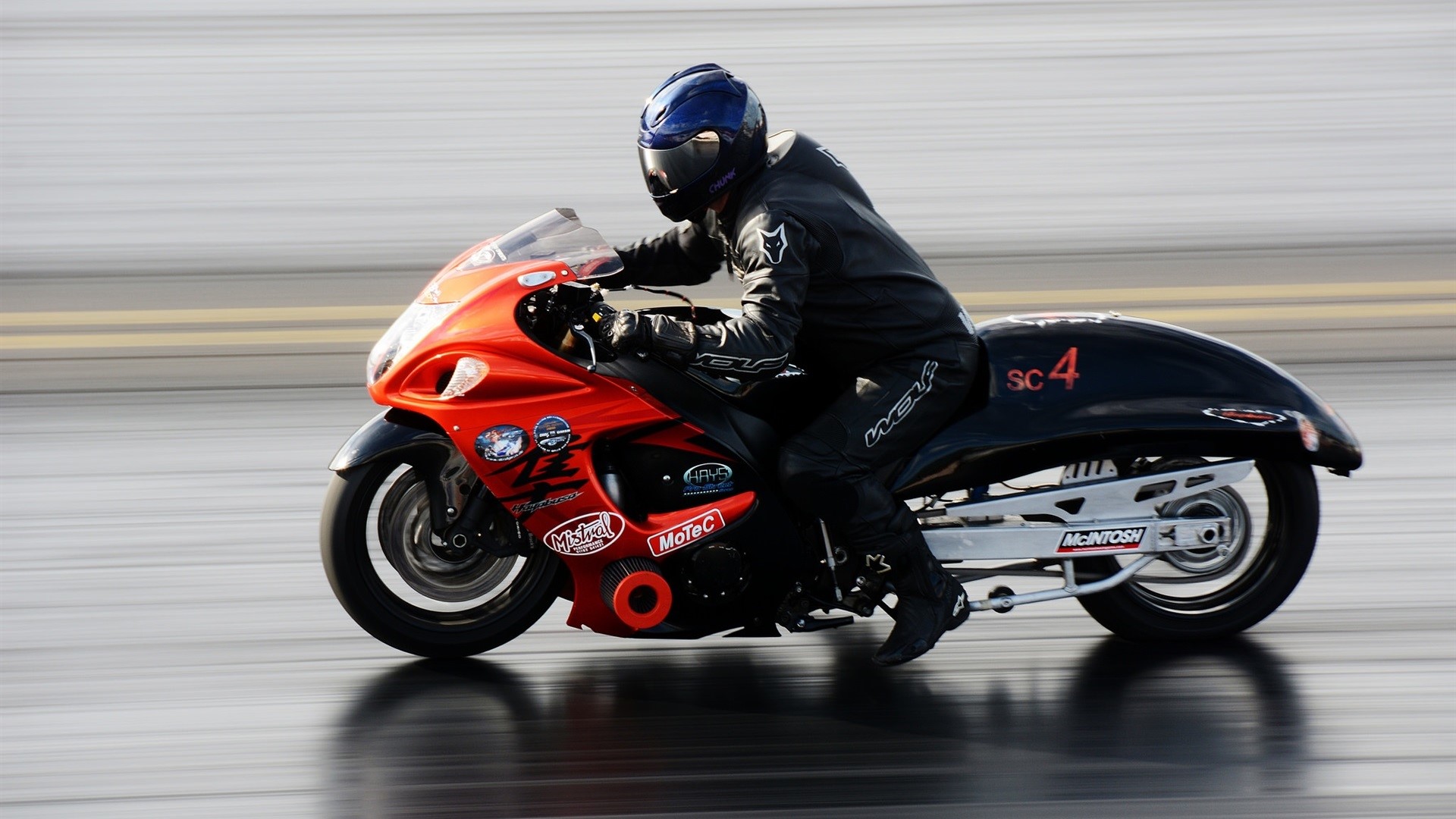 Drag racer on a Suzuki Hayabusa motorcycle HD Wallpaper