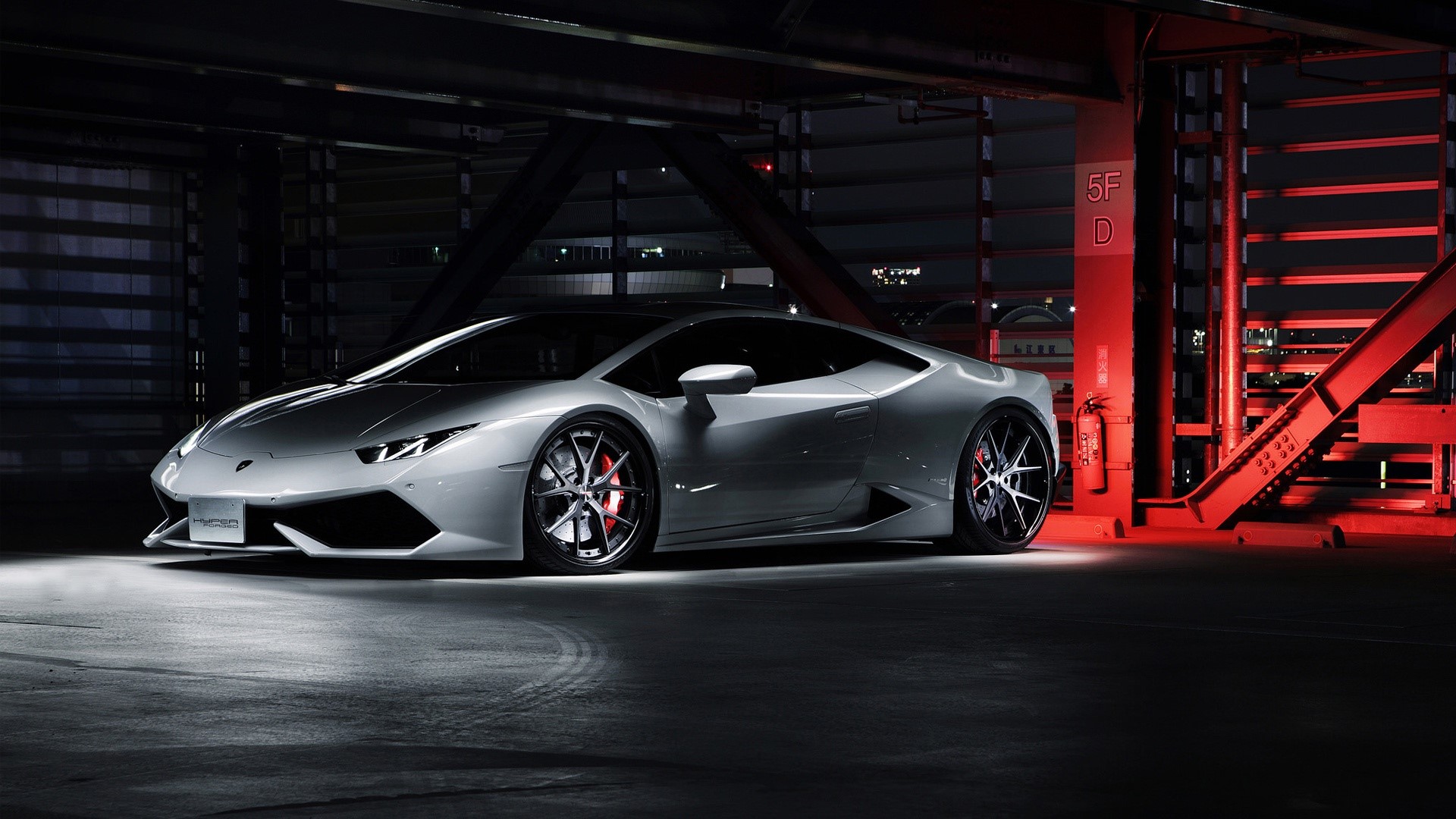 Silver Lamborghini Huracan in parking garage HD Wallpaper