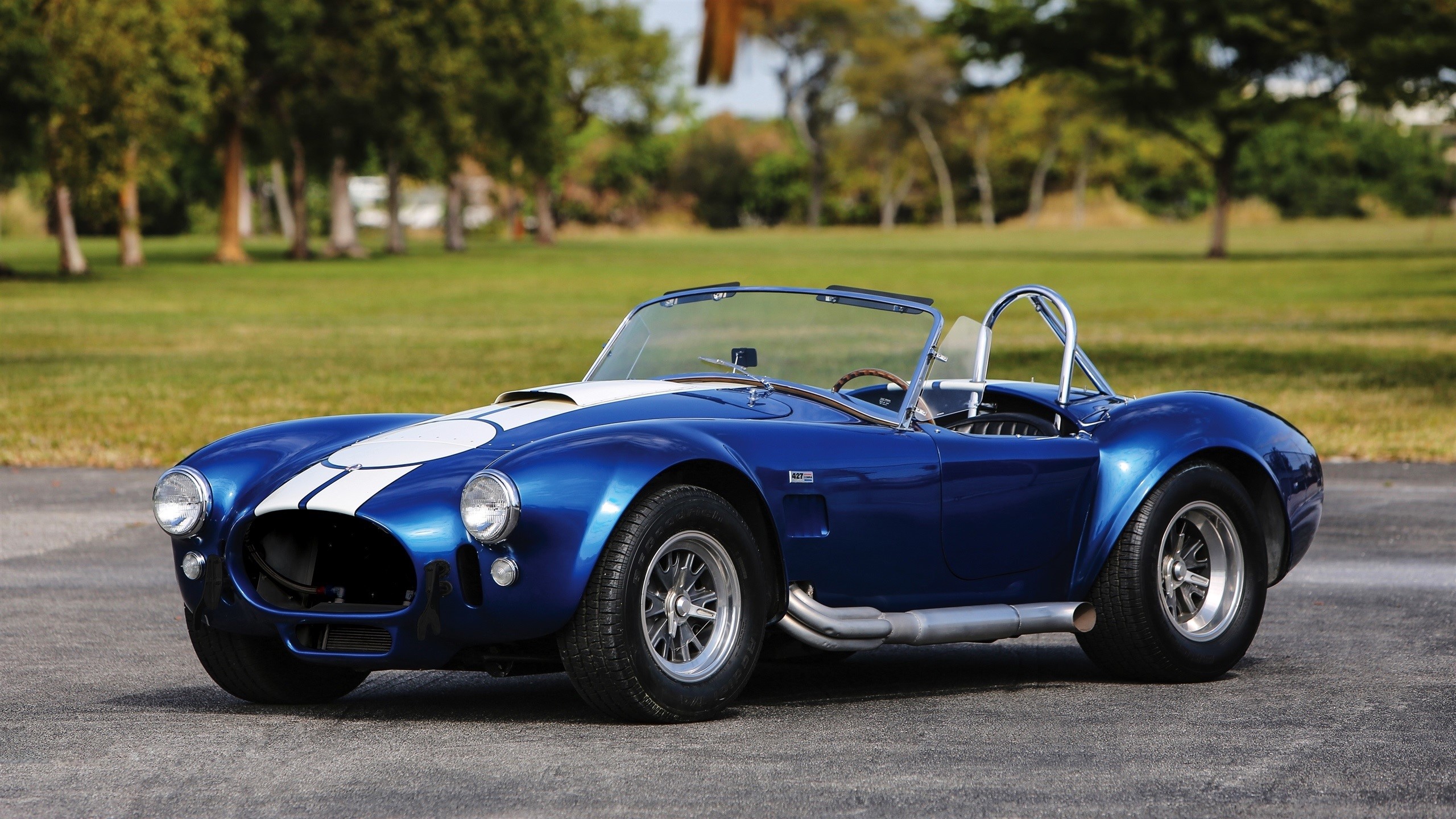 Blue Shelby Cobra 427 with white stripes on asphalt HD Wallpaper