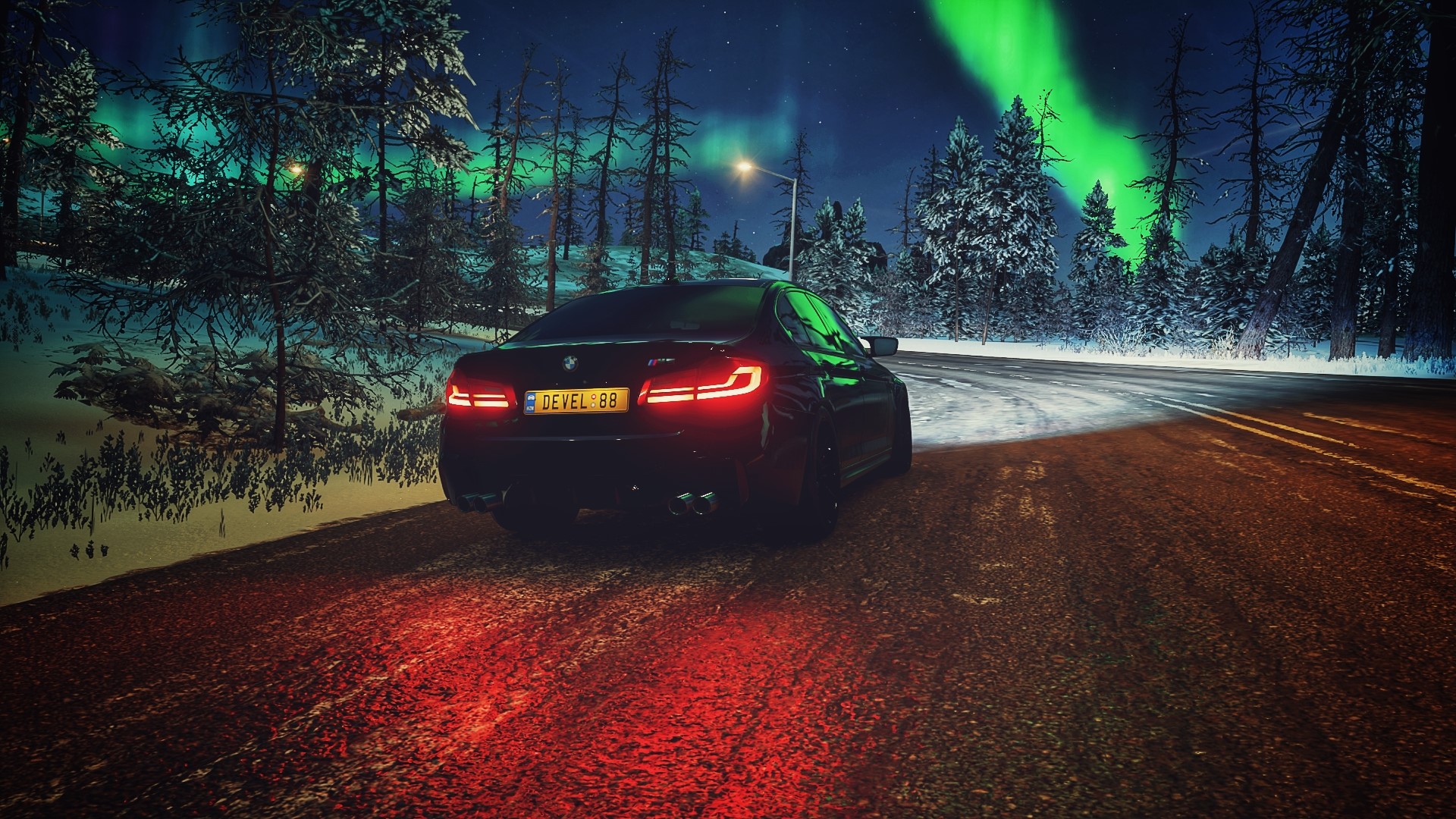 BMW M5 F90 on a snowy road with aurora borealis HD Wallpaper
