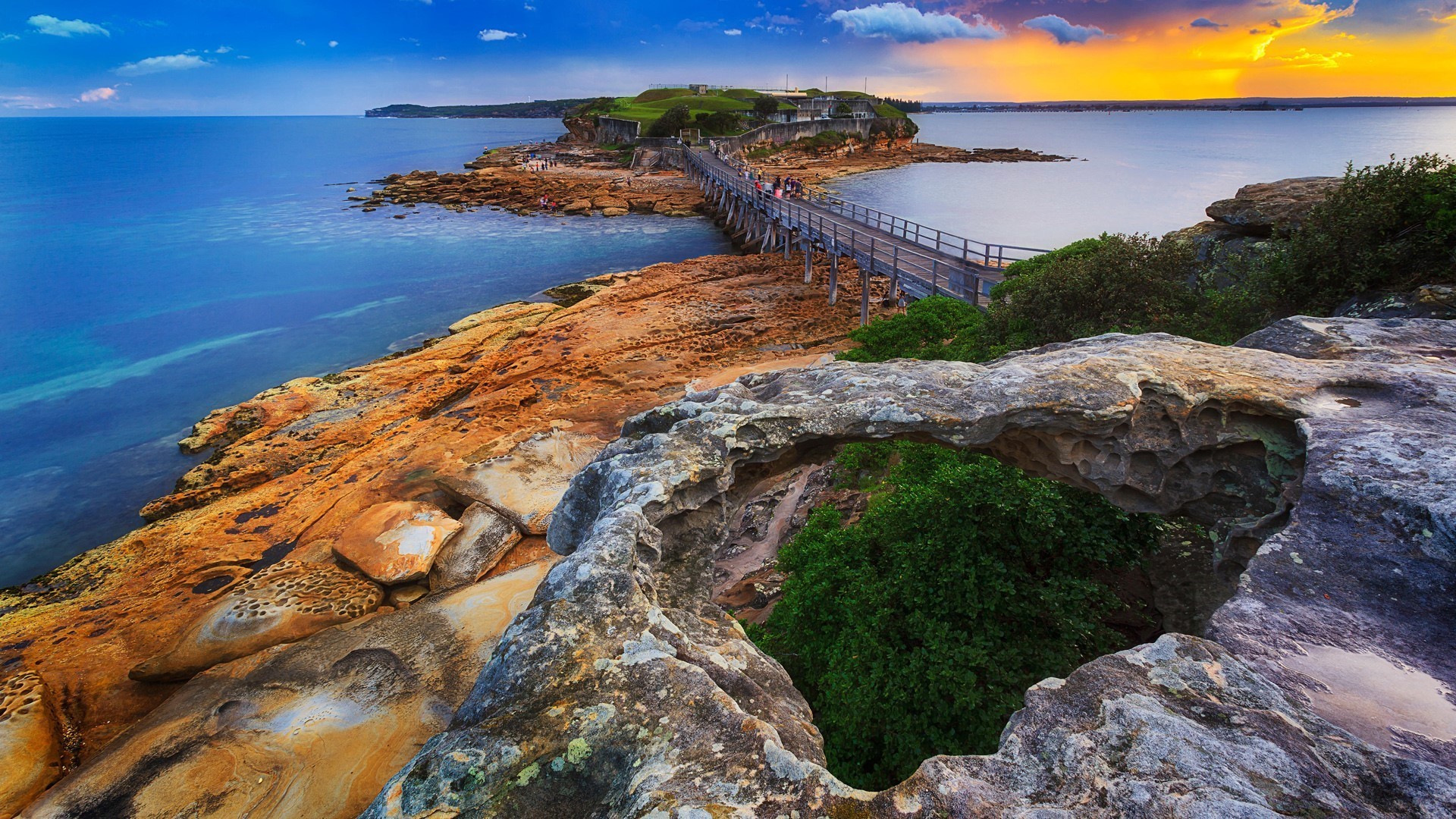 Wooden bridge connecting rocky islands at sunset in Sydney, Australia HD Wallpaper
