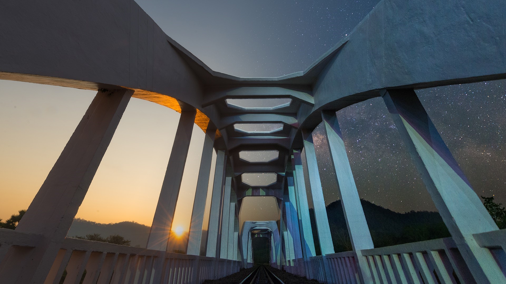 Bridge with sunrise and stars in Thailand HD Wallpaper