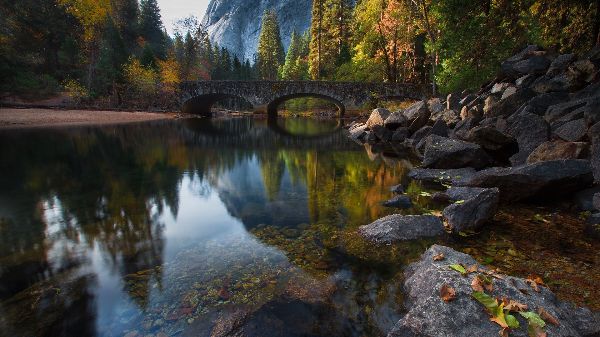 Stone bridge over a river in Yosemite National Park during autumn HD Wallpaper