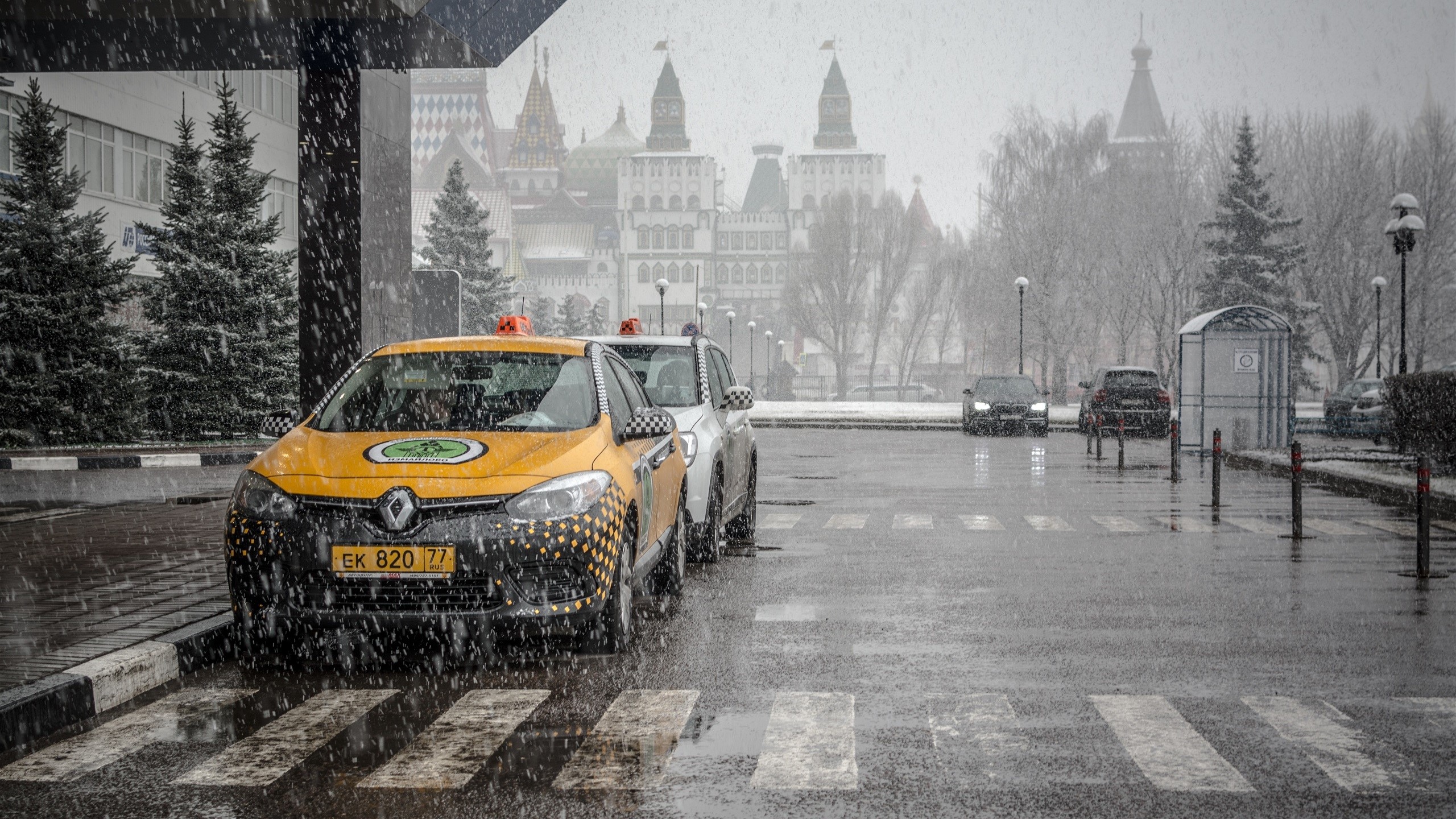 Yellow taxi cars in Moscow during snowfall HD Wallpaper