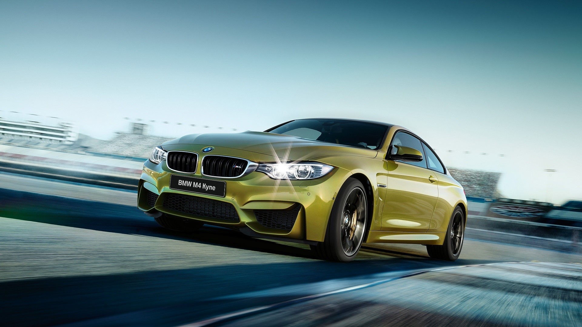 Yellow BMW M4 Kyne on a race track HD Wallpaper