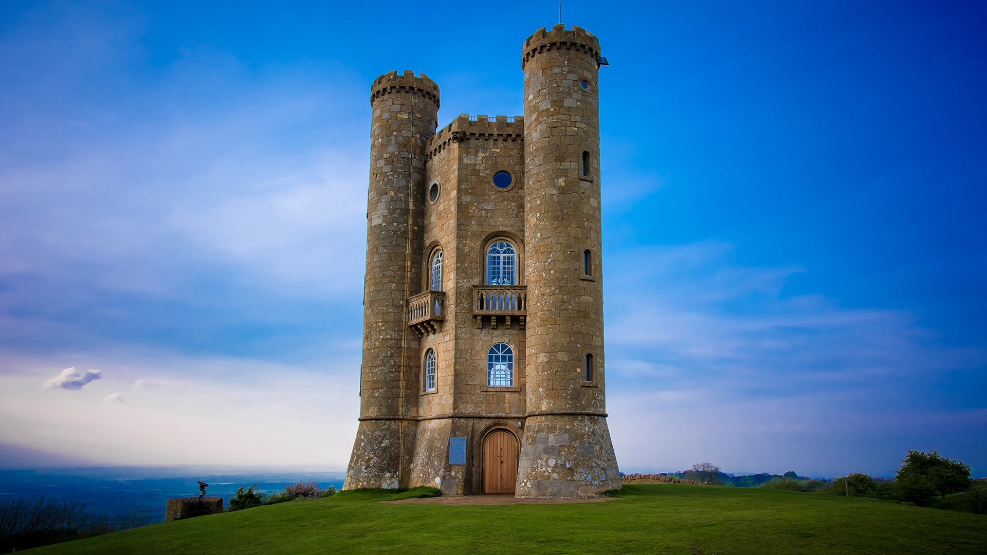 Broadway Tower on a hill under a blue sky HD Wallpaper
