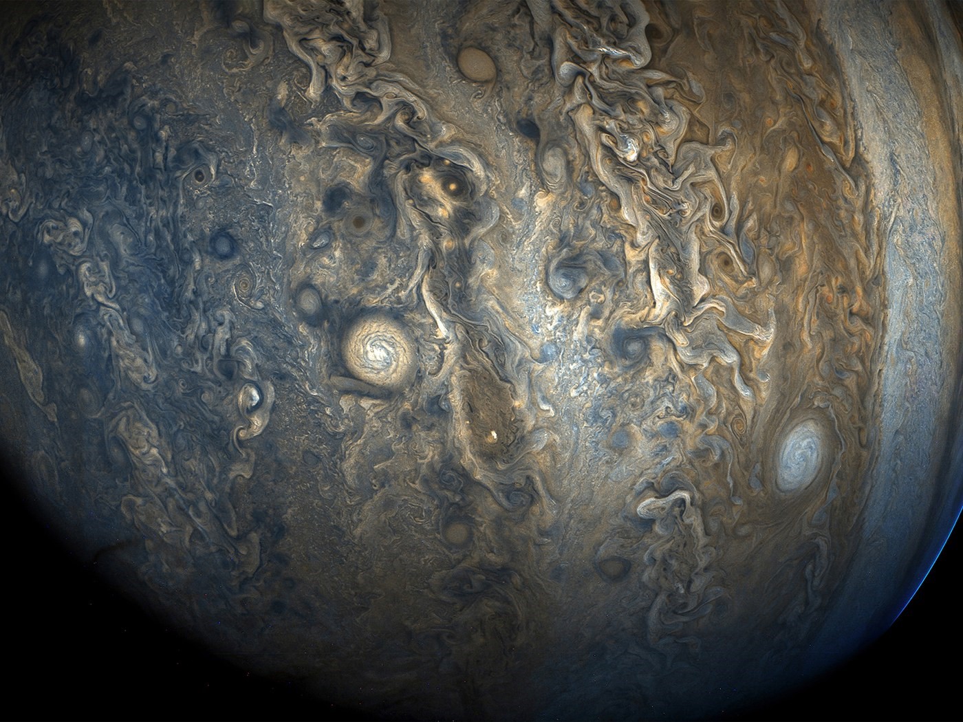 Jupiter's swirling clouds and storms HD Wallpaper