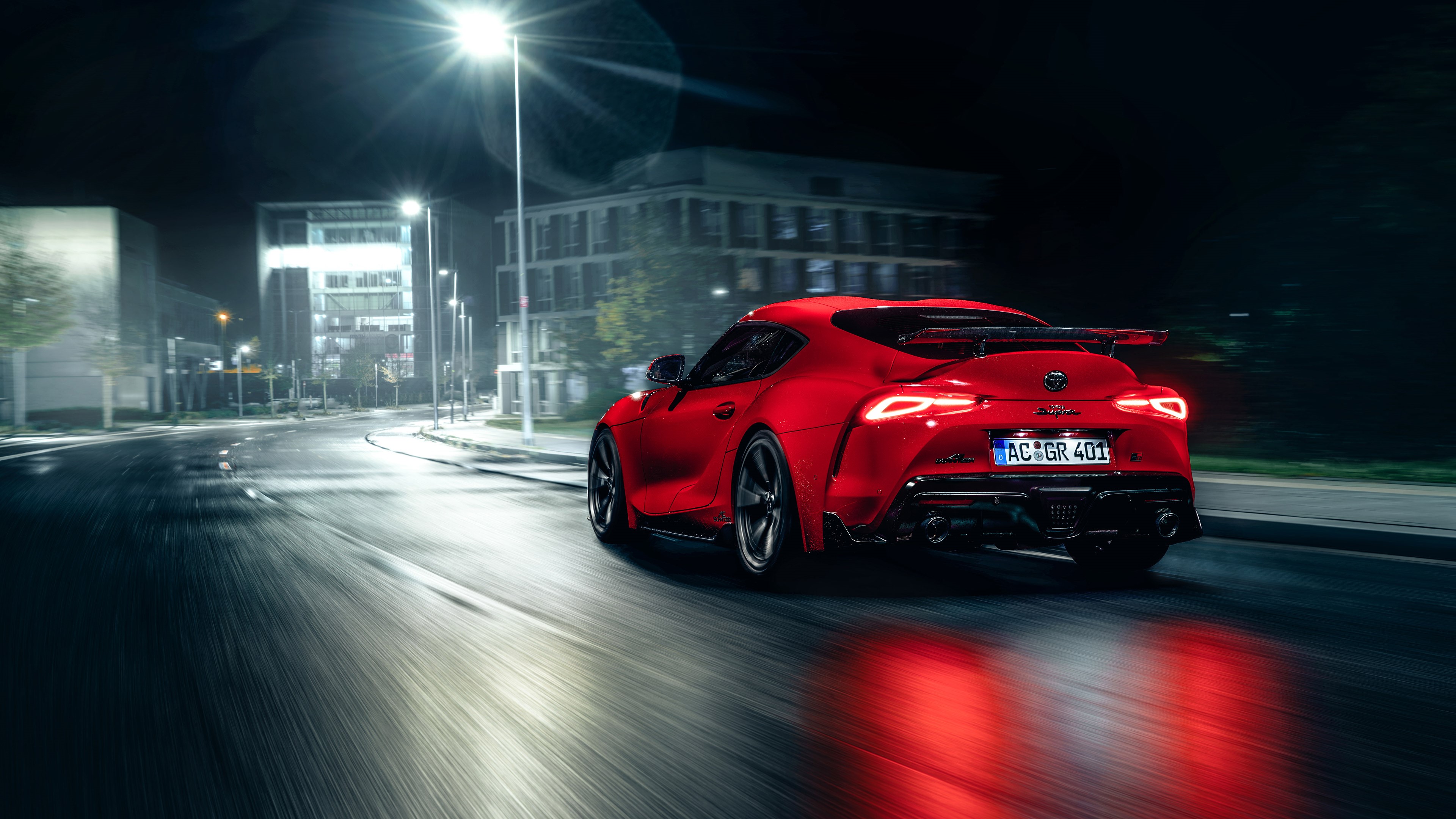 Red Toyota Supra driving at night with motion blur HD Wallpaper
