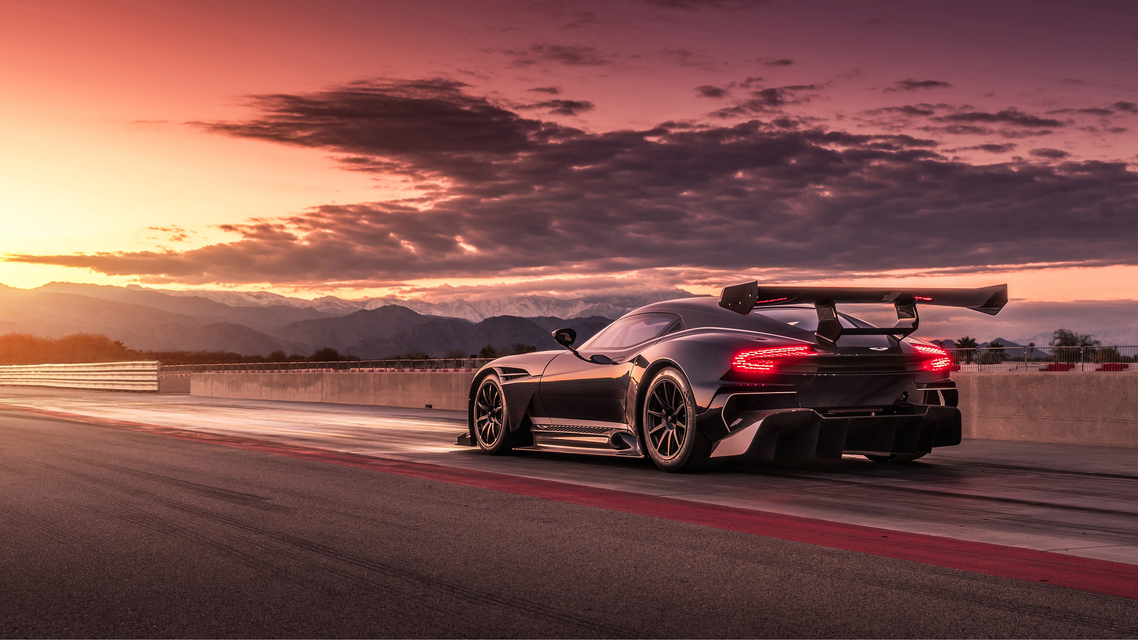 Aston Martin Vulcan on race track at sunset HD Wallpaper