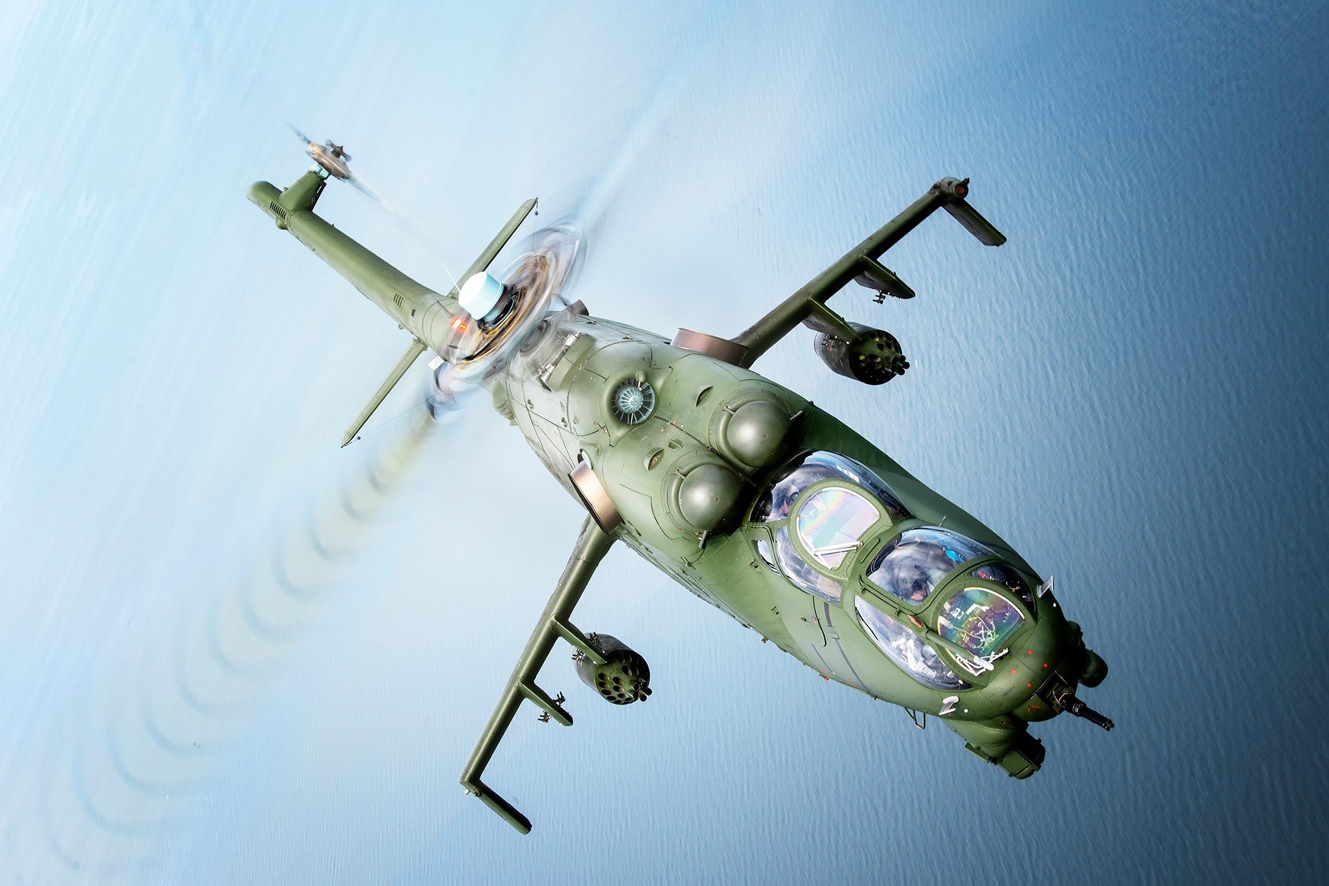 Mi-24 Hind helicopter in flight over water HD Wallpaper