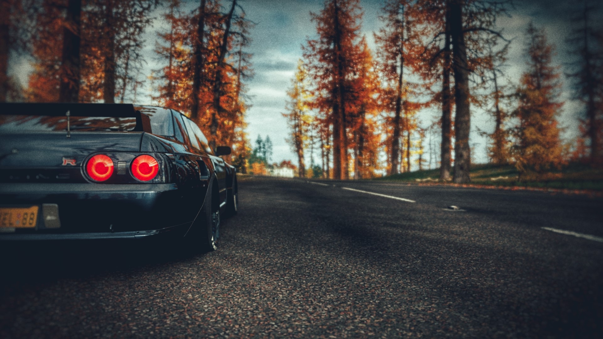 Nissan GTR R32 on a road with autumn trees HD Wallpaper