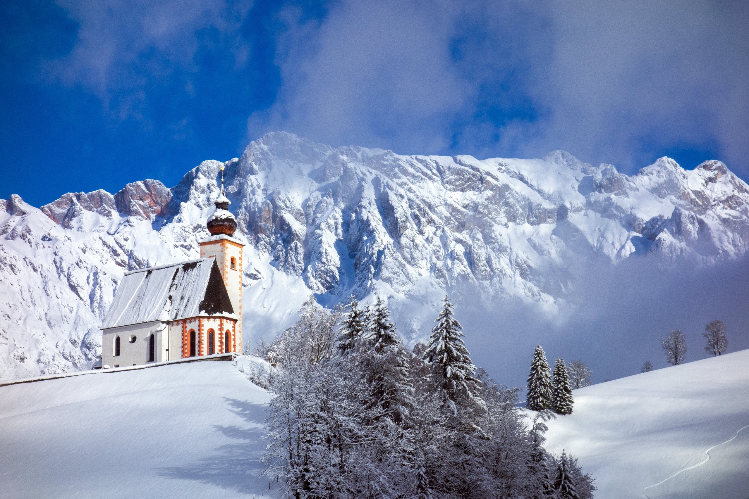 Winter church in snowy mountains HD Wallpaper