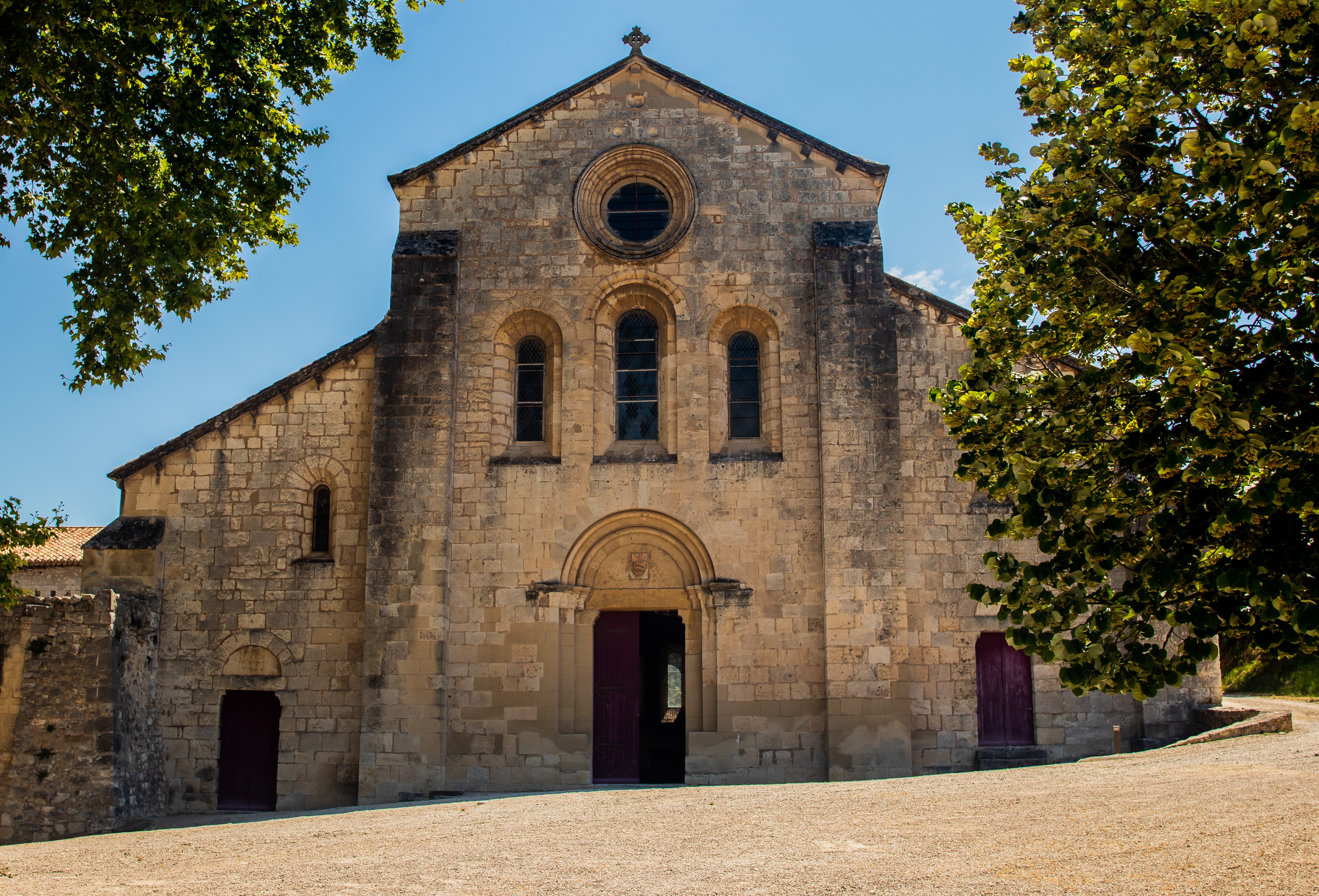 Frontal view of a stone monastery in Provence, France HD Wallpaper