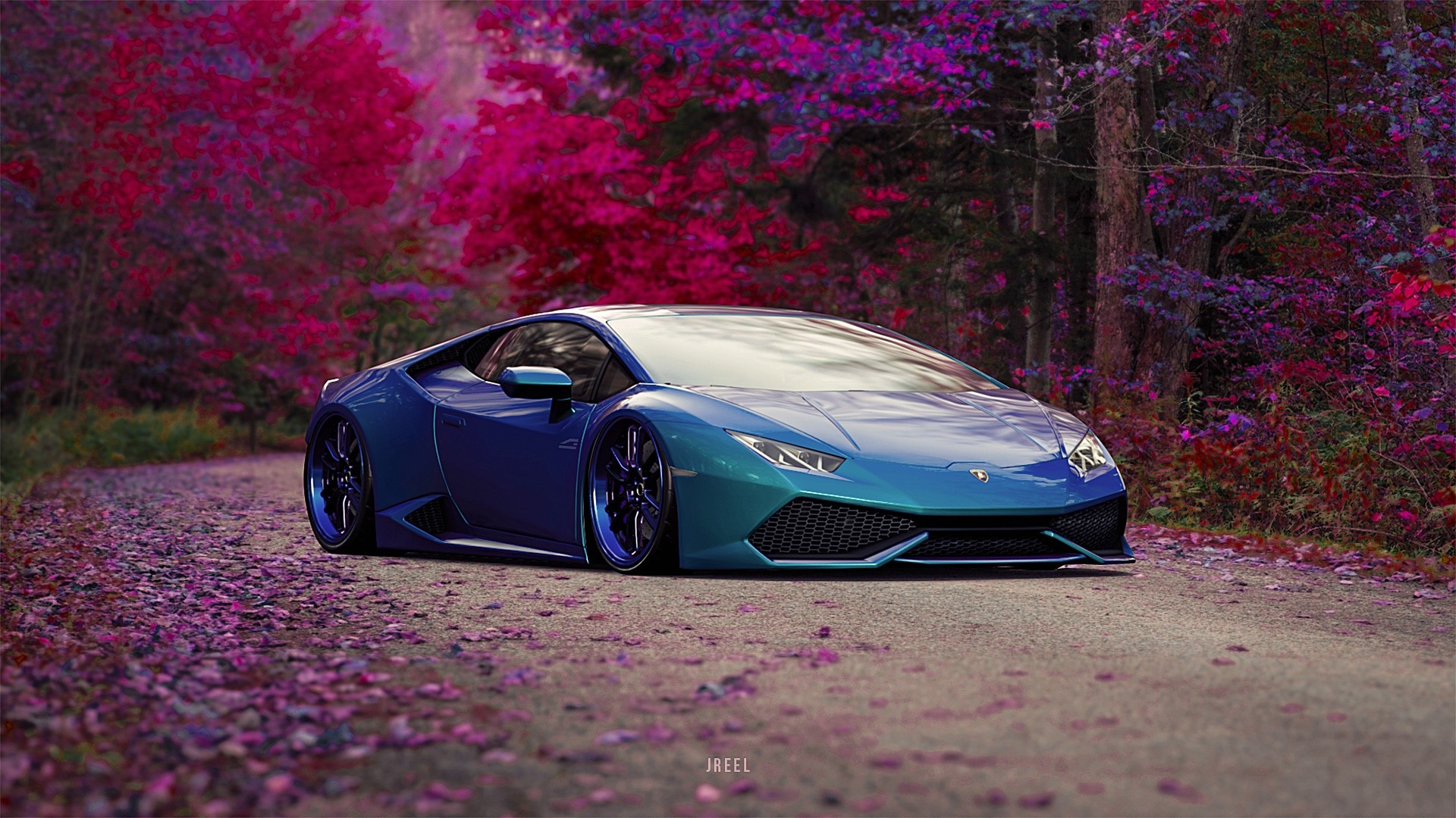 Blue Lamborghini Huracan with colored wheels on a forest road HD Wallpaper