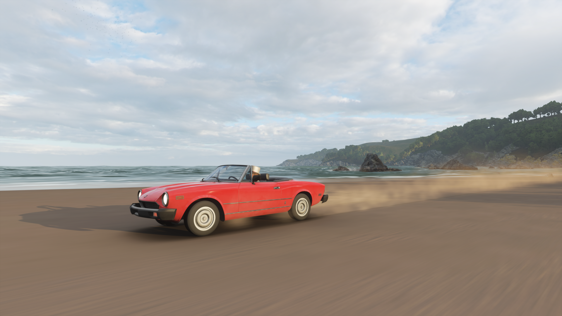 Red convertible car driving on a beach HD Wallpaper