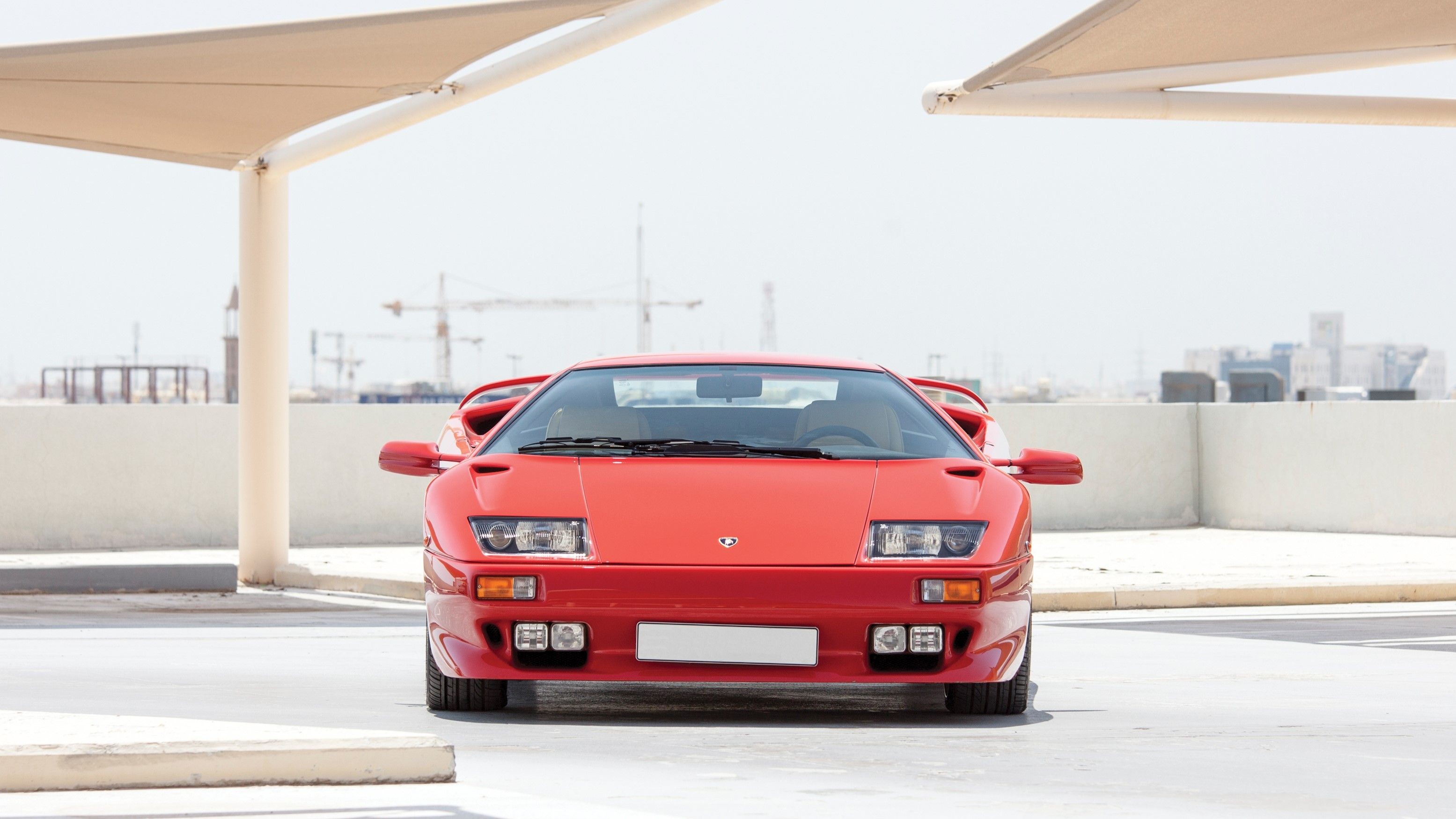 Red Lamborghini Diablo SV parked outdoors HD Wallpaper