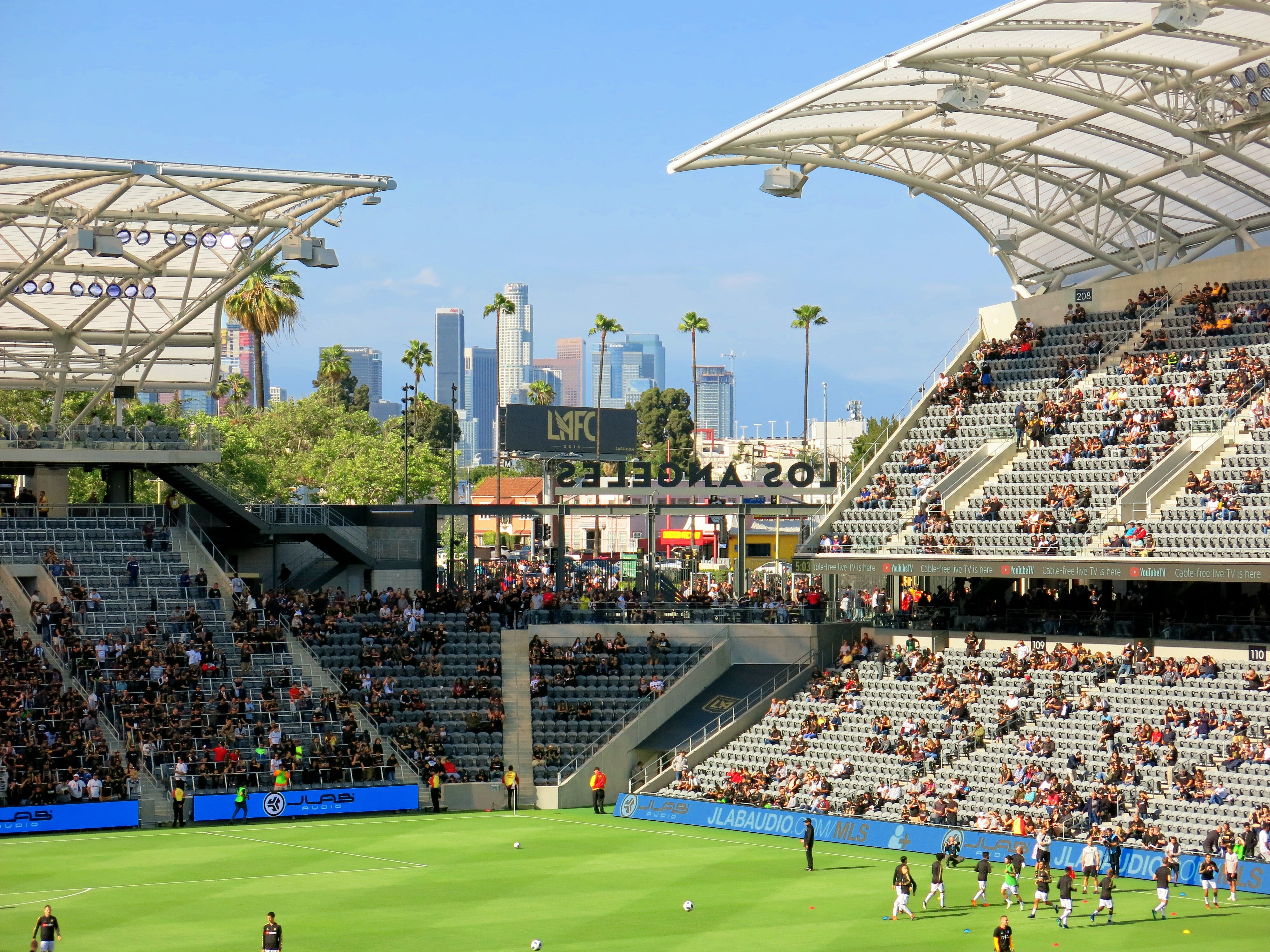 LAFC stadium with Los Angeles skyline HD Wallpaper