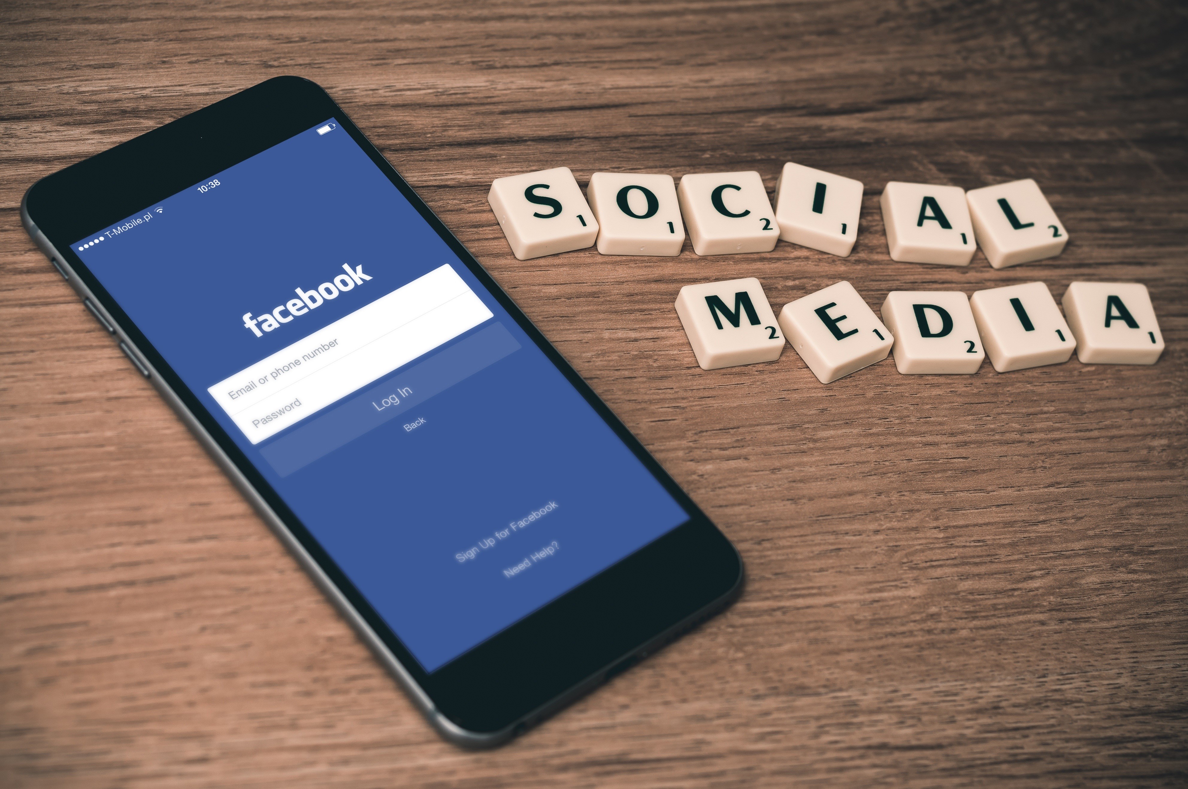 Facebook login screen on smartphone with "SOCIAL MEDIA" tiles HD Wallpaper
