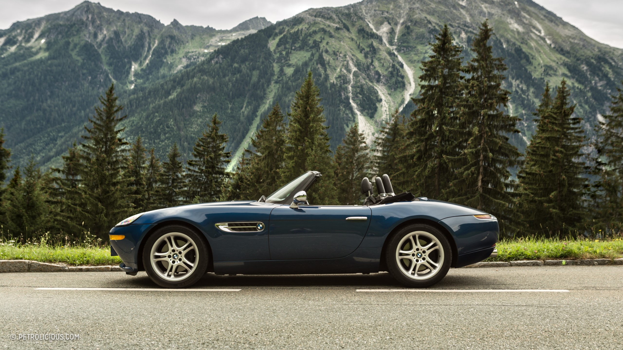 Blue BMW Z8 convertible parked on a mountain road HD Wallpaper