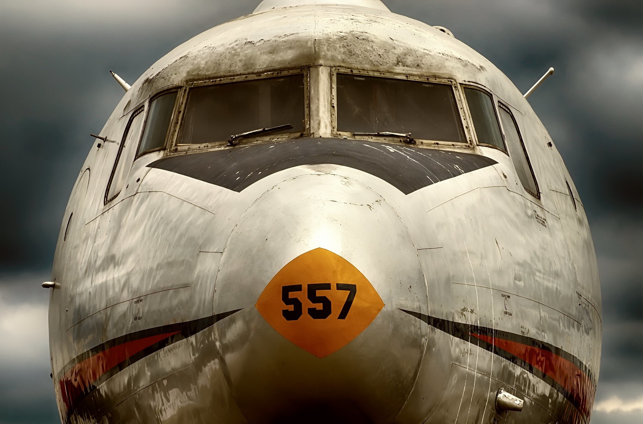 Close-up of an old aircraft nose with number 557 HD Wallpaper