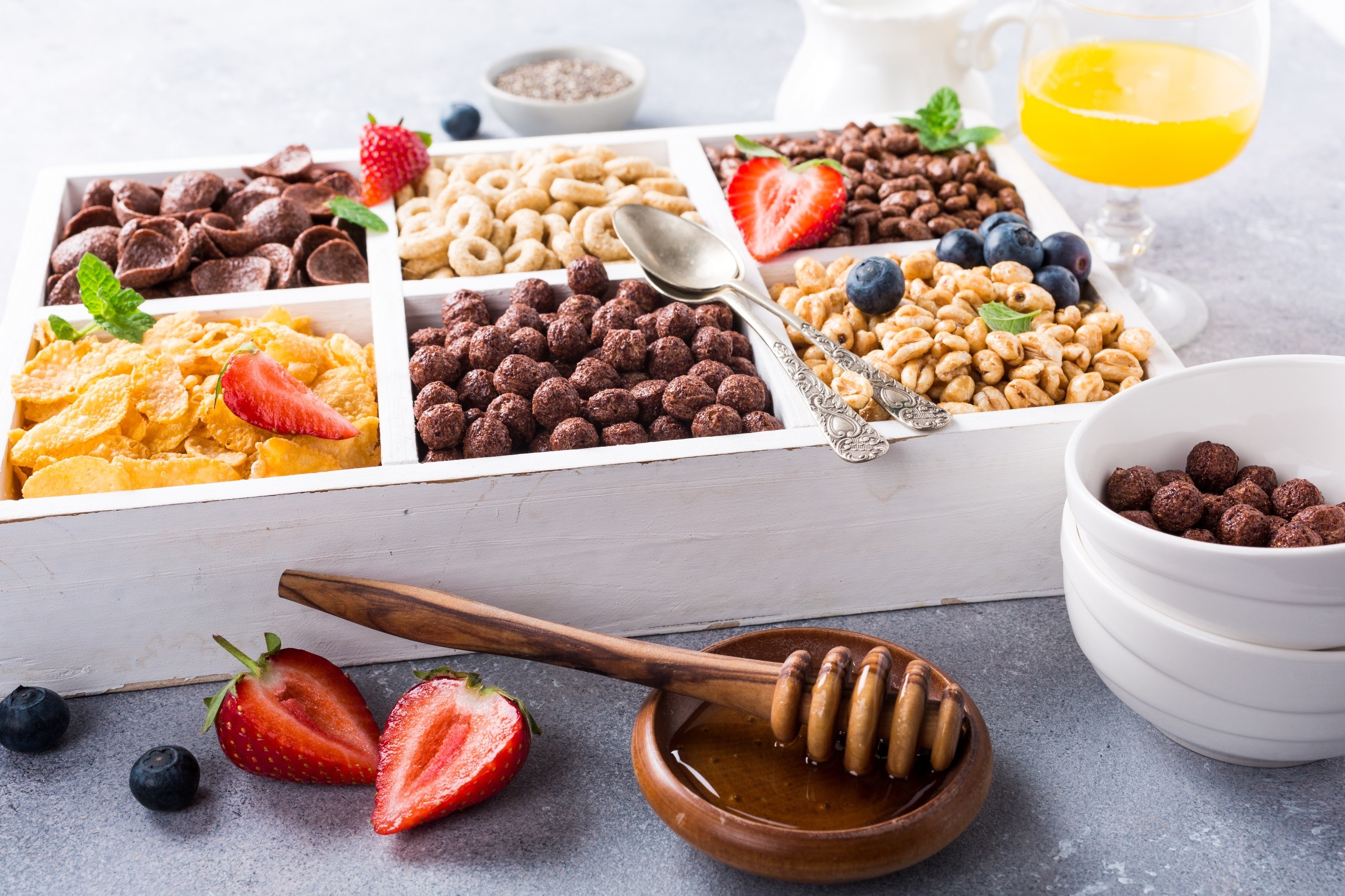 Assortment of breakfast cereals with fruits and honey HD Wallpaper