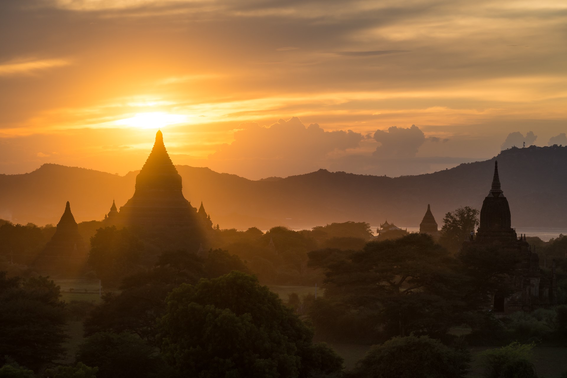 Temples and pagodas at sunset in Bagan, Myanmar HD Wallpaper