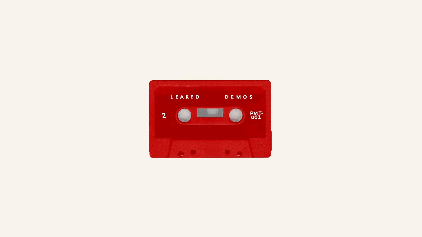 Red cassette tape labeled "LEAKED DEMOS" HD Wallpaper