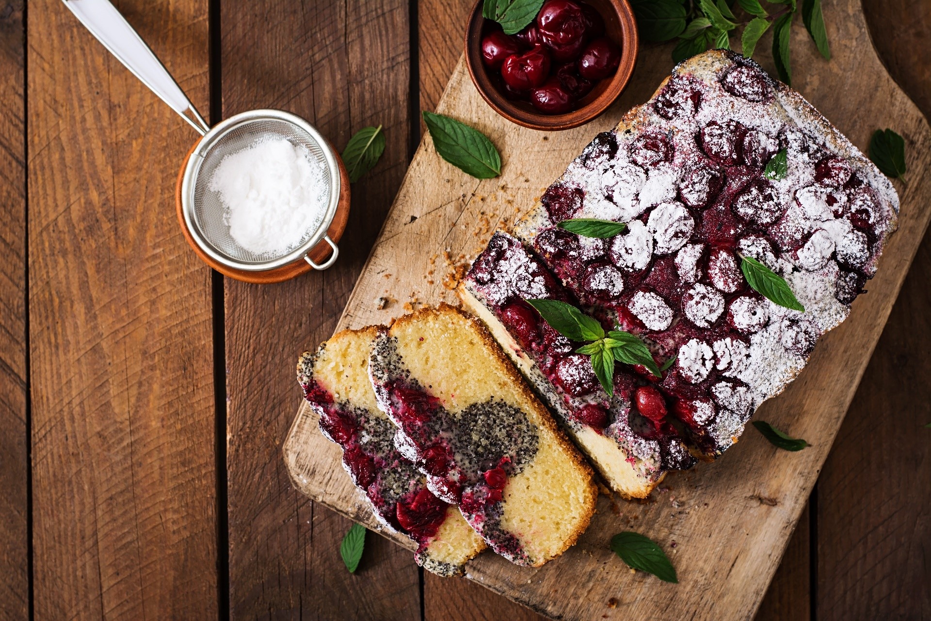 Cherry and poppy seed cake with powdered sugar HD Wallpaper