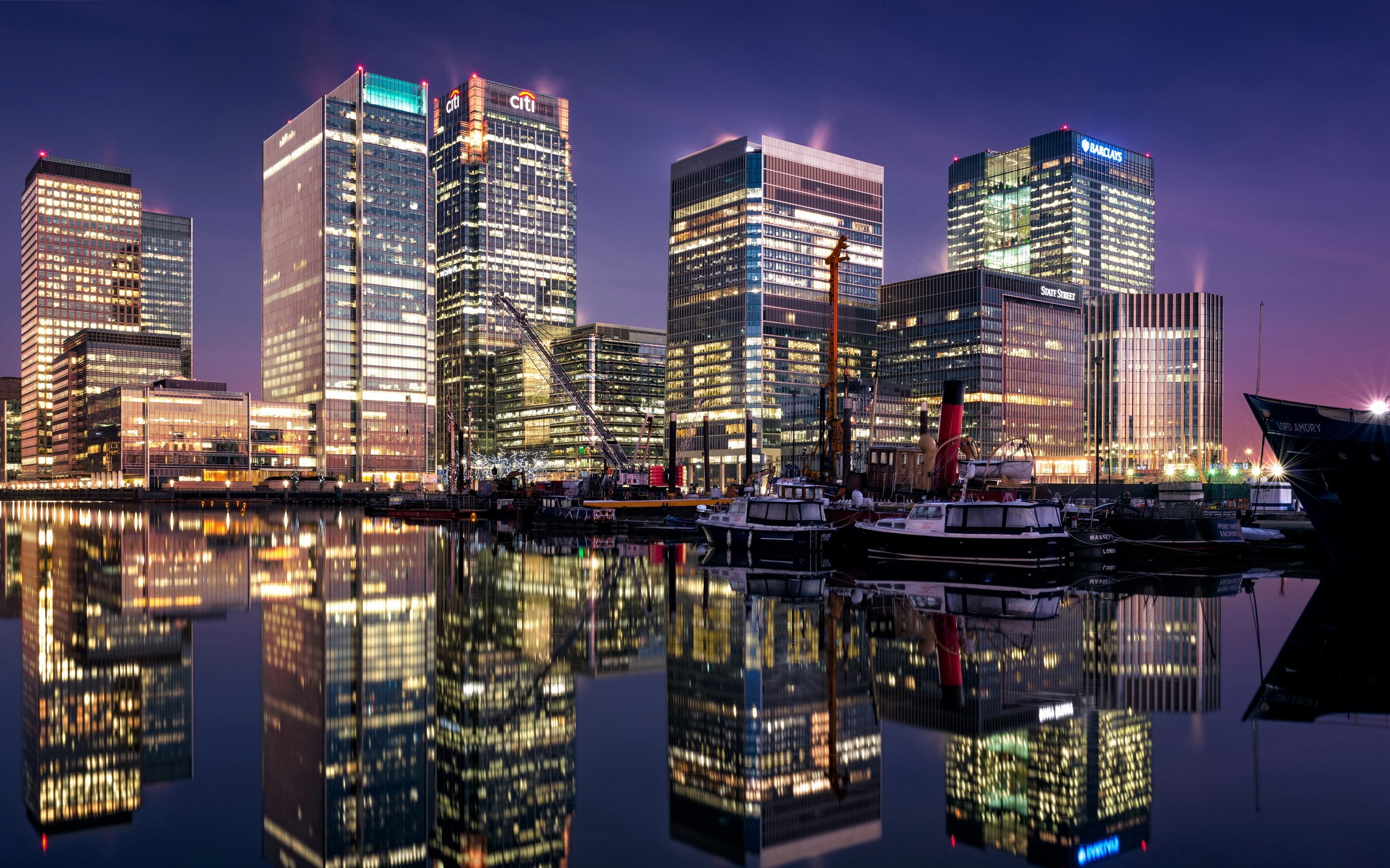 Canary Wharf skyscrapers reflected in water at night HD Wallpaper