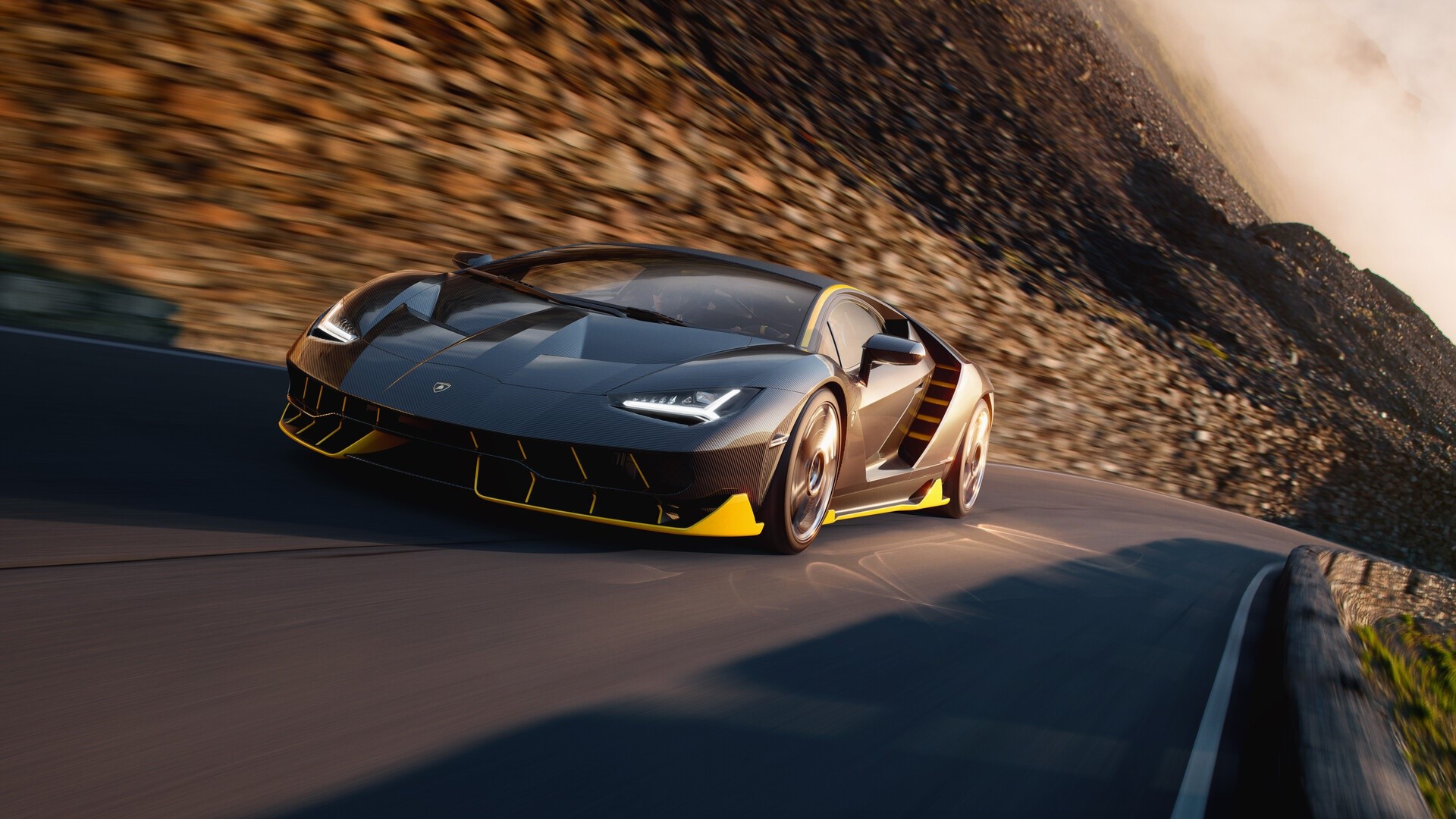 Lamborghini Centenario driving on a mountain road HD Wallpaper