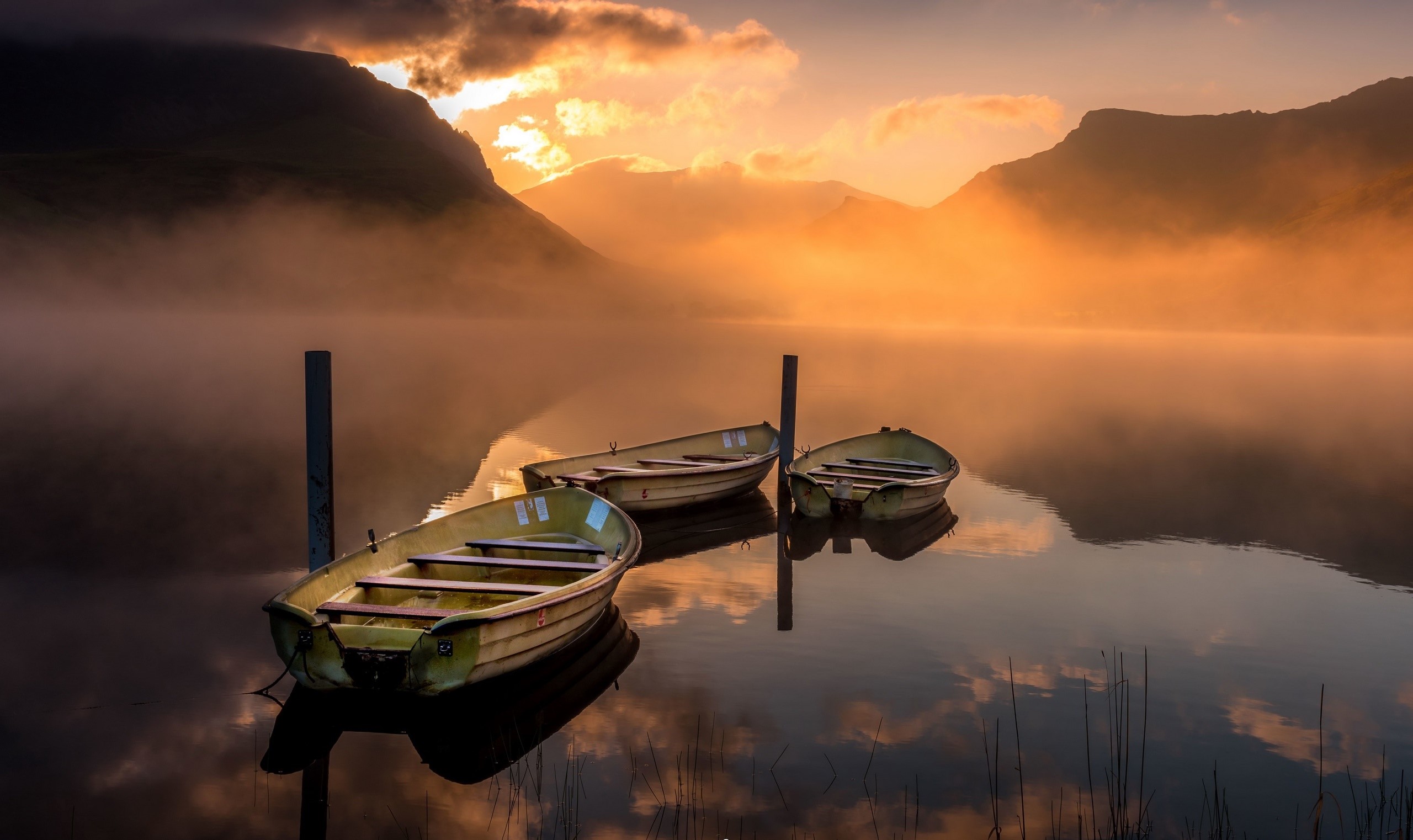 Boats on a misty lake at sunrise HD Wallpaper