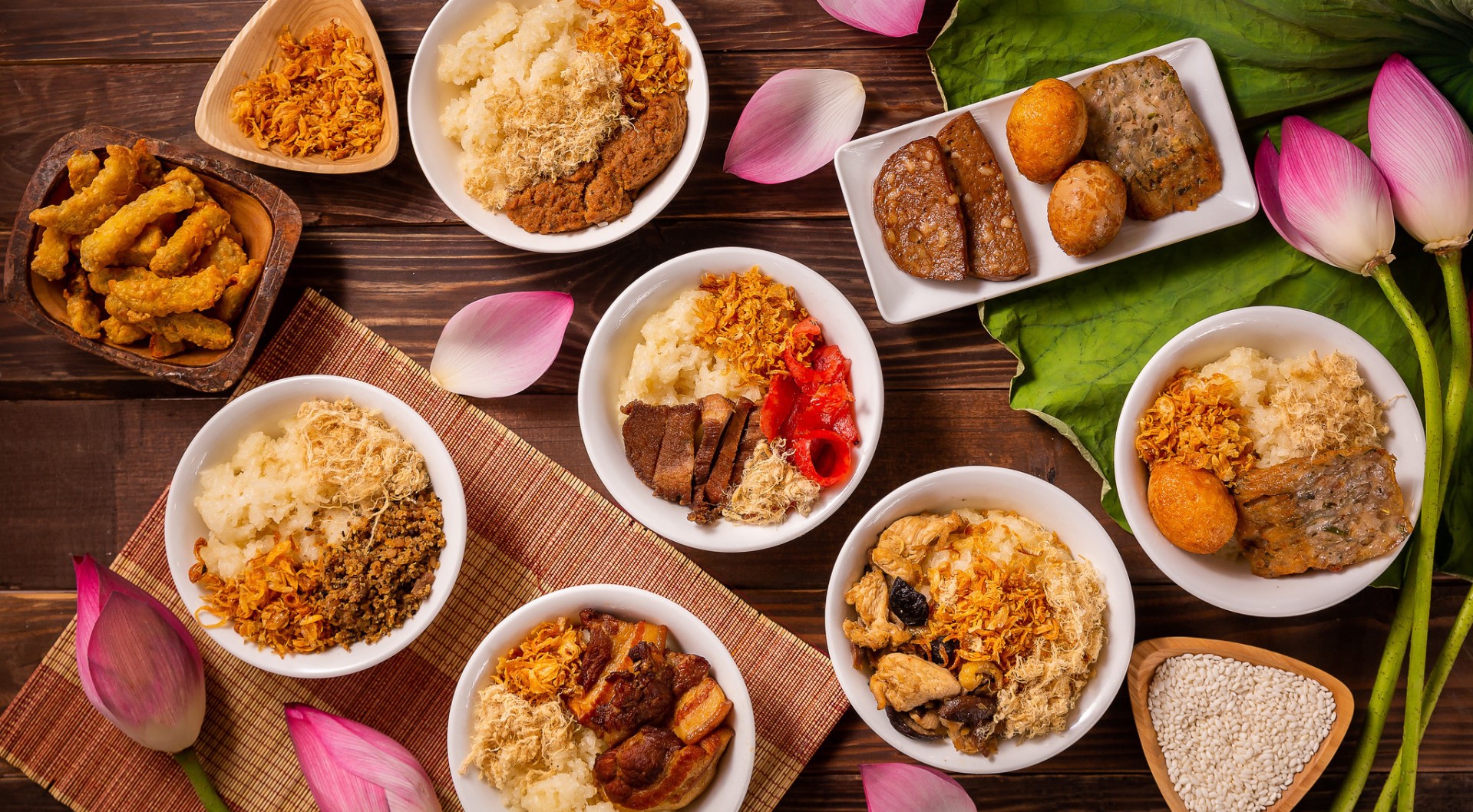 Vietnamese sticky rice dishes with toppings and lotus flowers HD Wallpaper