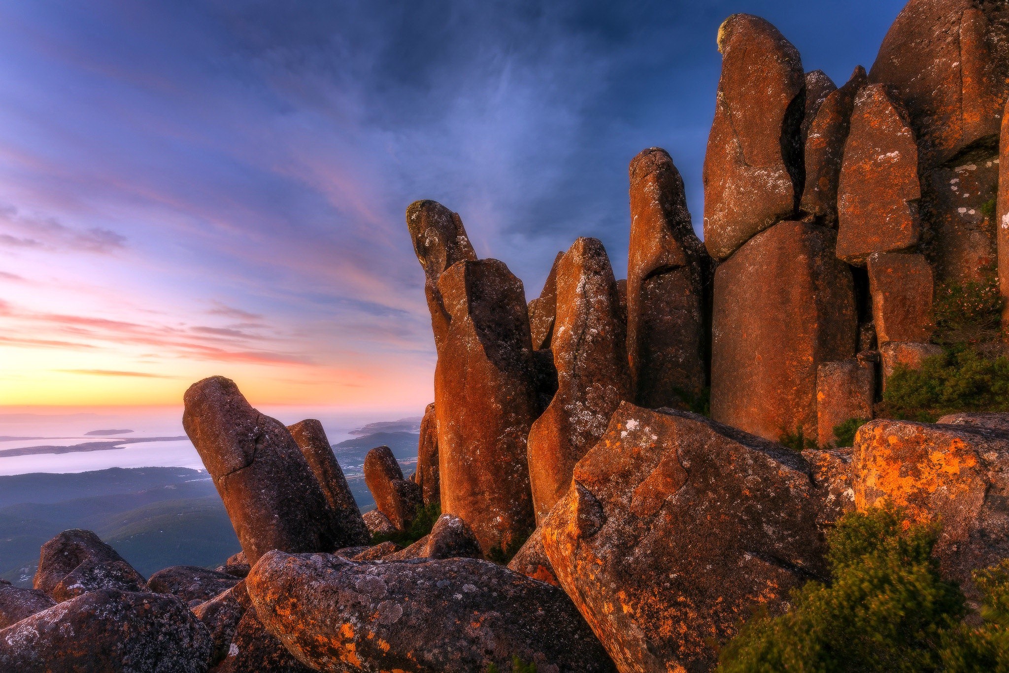 Dramatic rock formations at sunset with colorful sky HD Wallpaper