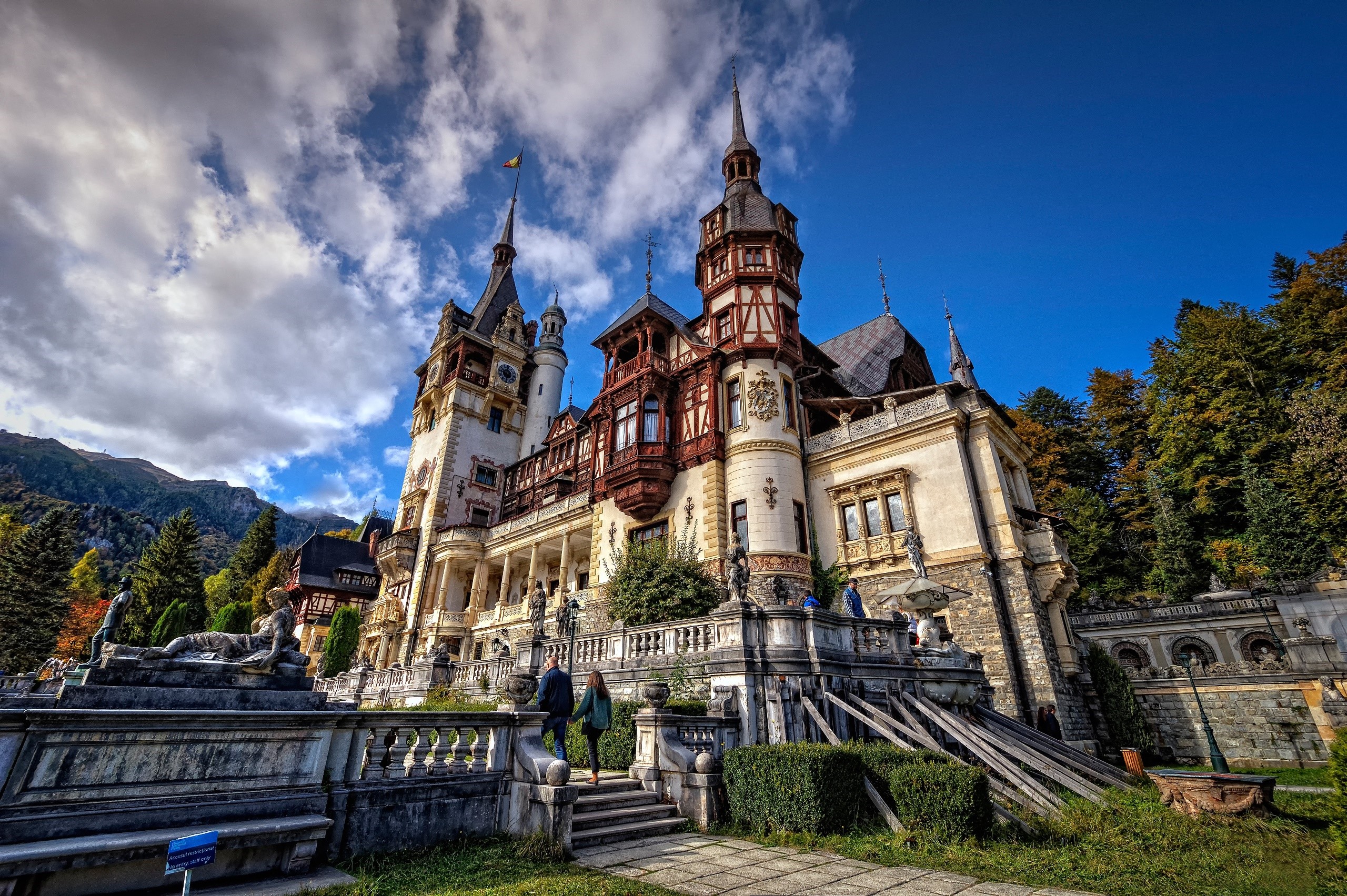 Peleș Castle in Romania under a cloudy sky HD Wallpaper