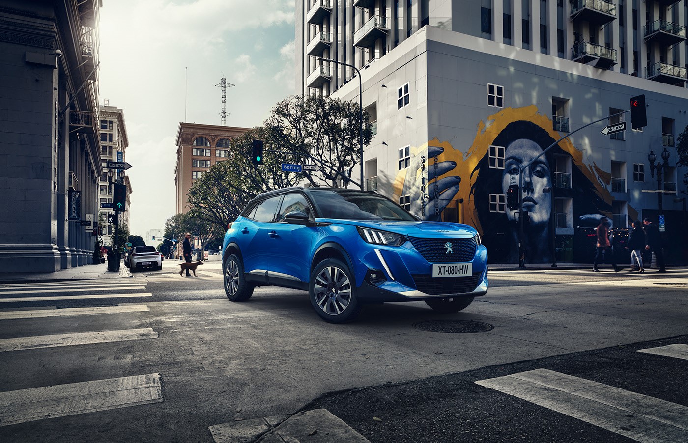 Blue Peugeot 2008 SUV on city street with graffiti HD Wallpaper