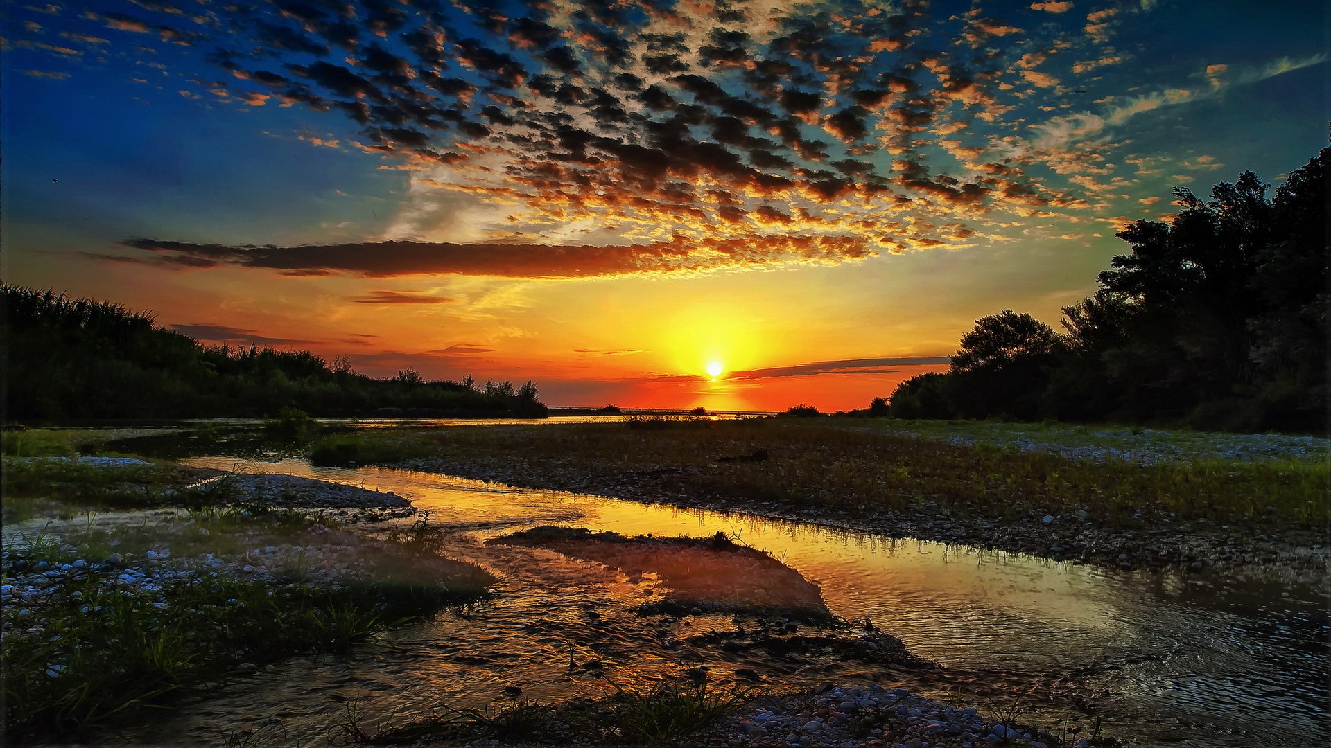 Sunset over a river with clouds and trees HD Wallpaper