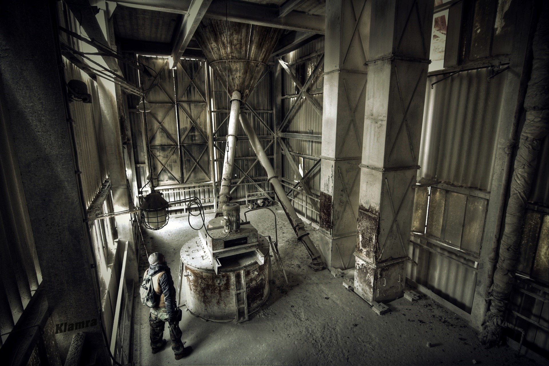 Abandoned factory interior with a person HD Wallpaper