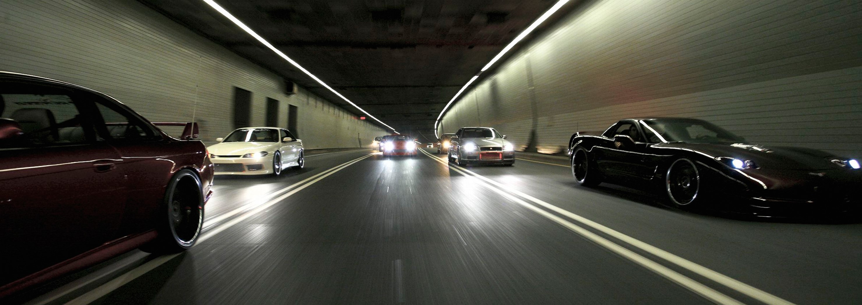 JDM cars racing through a tunnel HD Wallpaper