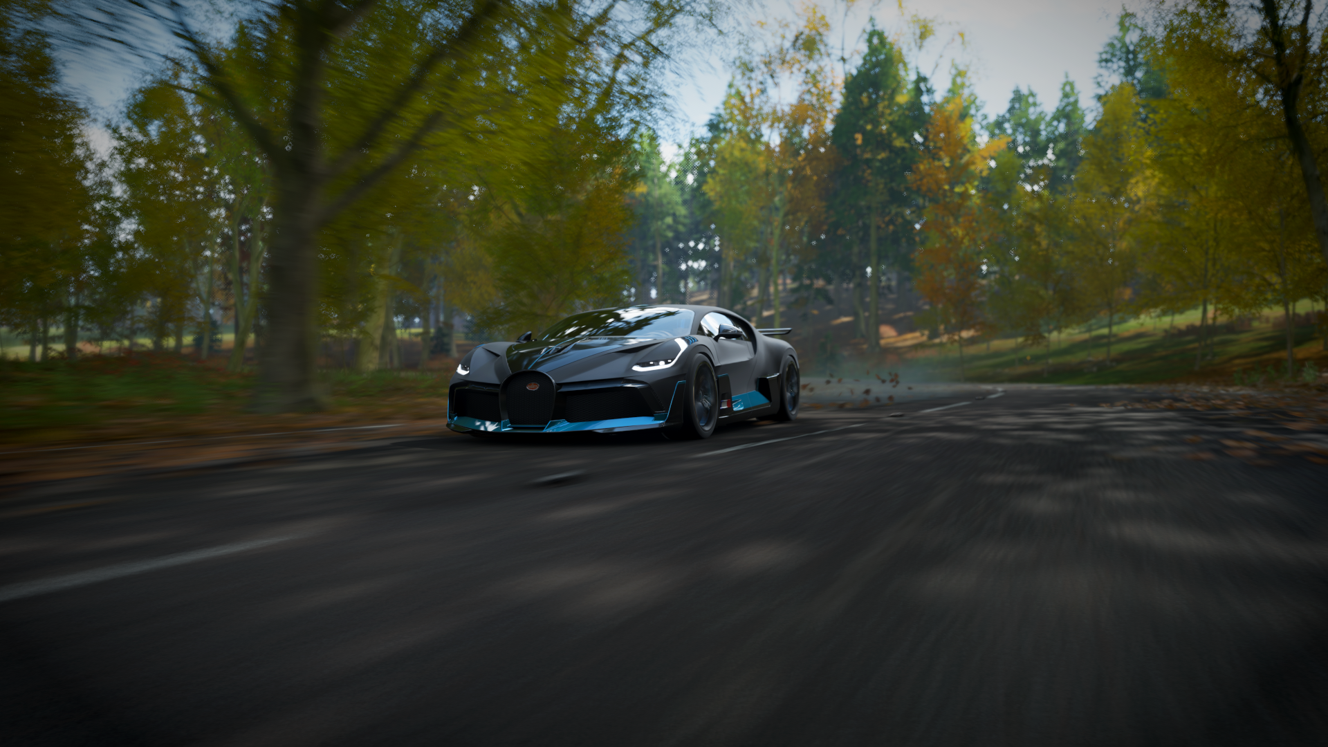 Bugatti Divo driving on a road in a forest HD Wallpaper