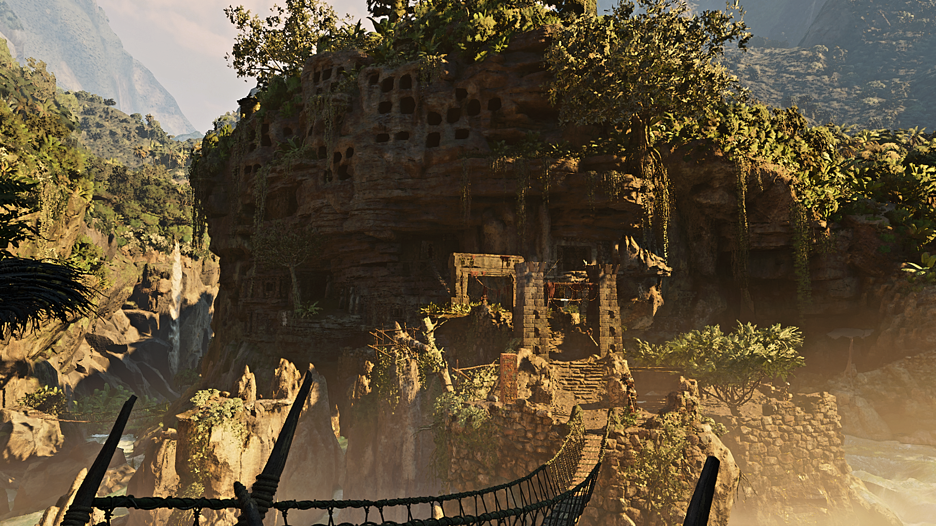 Ruins in a jungle canyon with a rope bridge HD Wallpaper