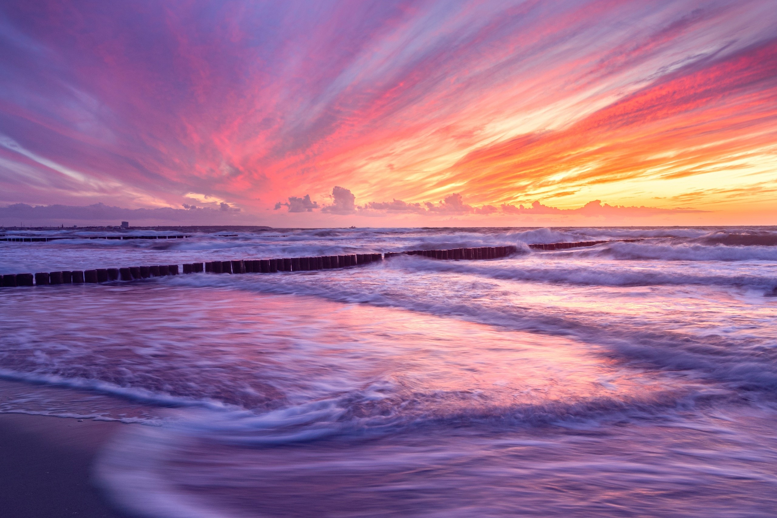 Colorful sunset over the Baltic Sea with groynes HD Wallpaper