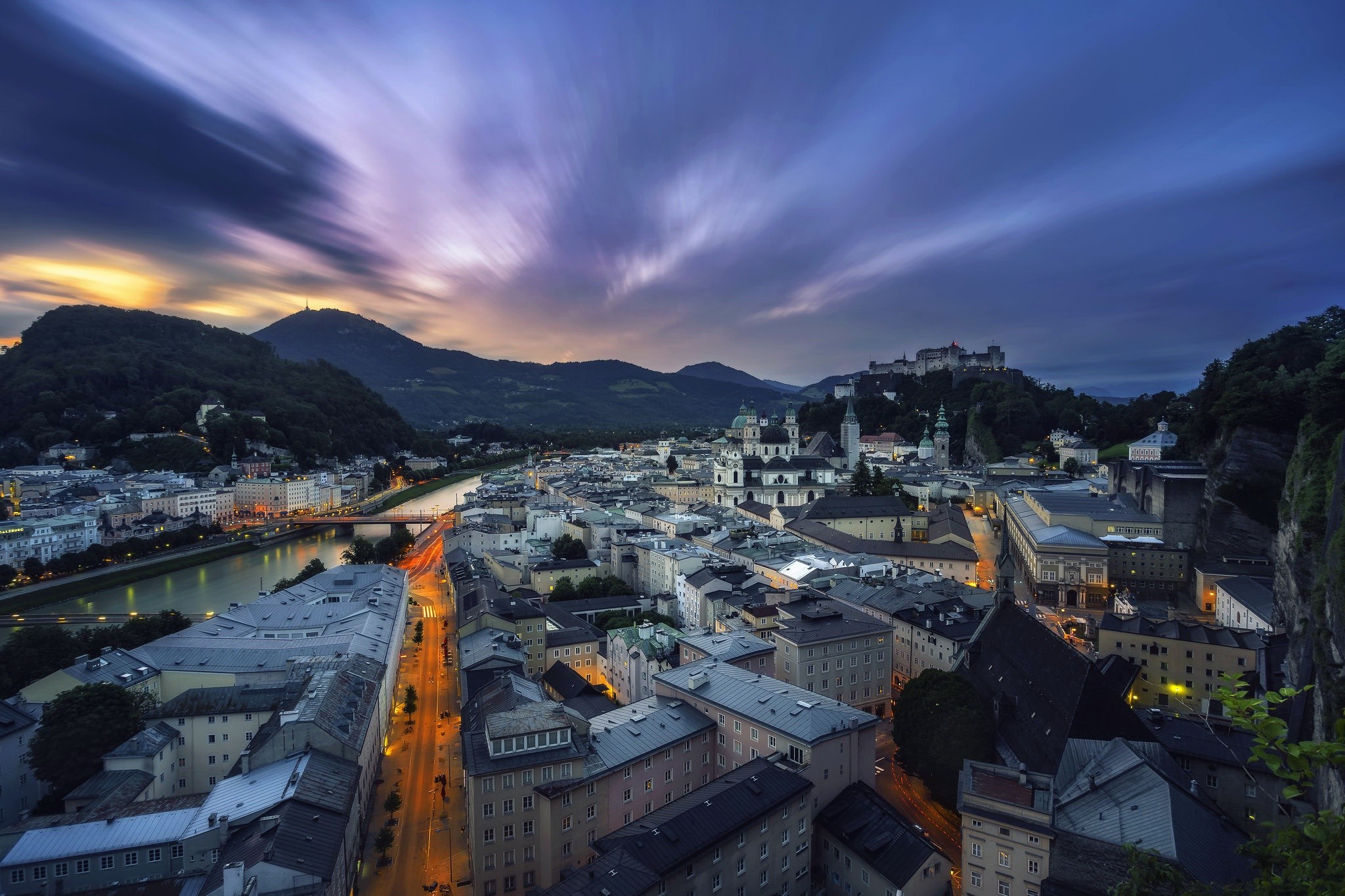 Salzburg cityscape with river and mountains at dusk HD Wallpaper